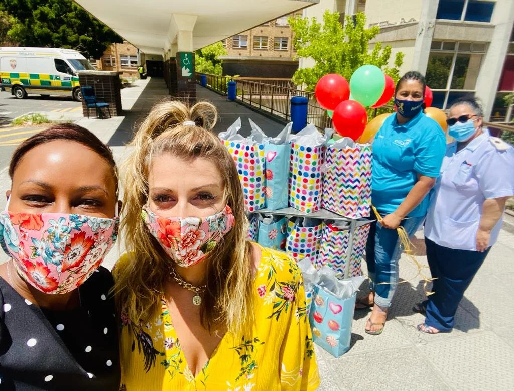 Santa's Helpers Elana and Kate bring Christmas Surprises to Children in the hospital. 