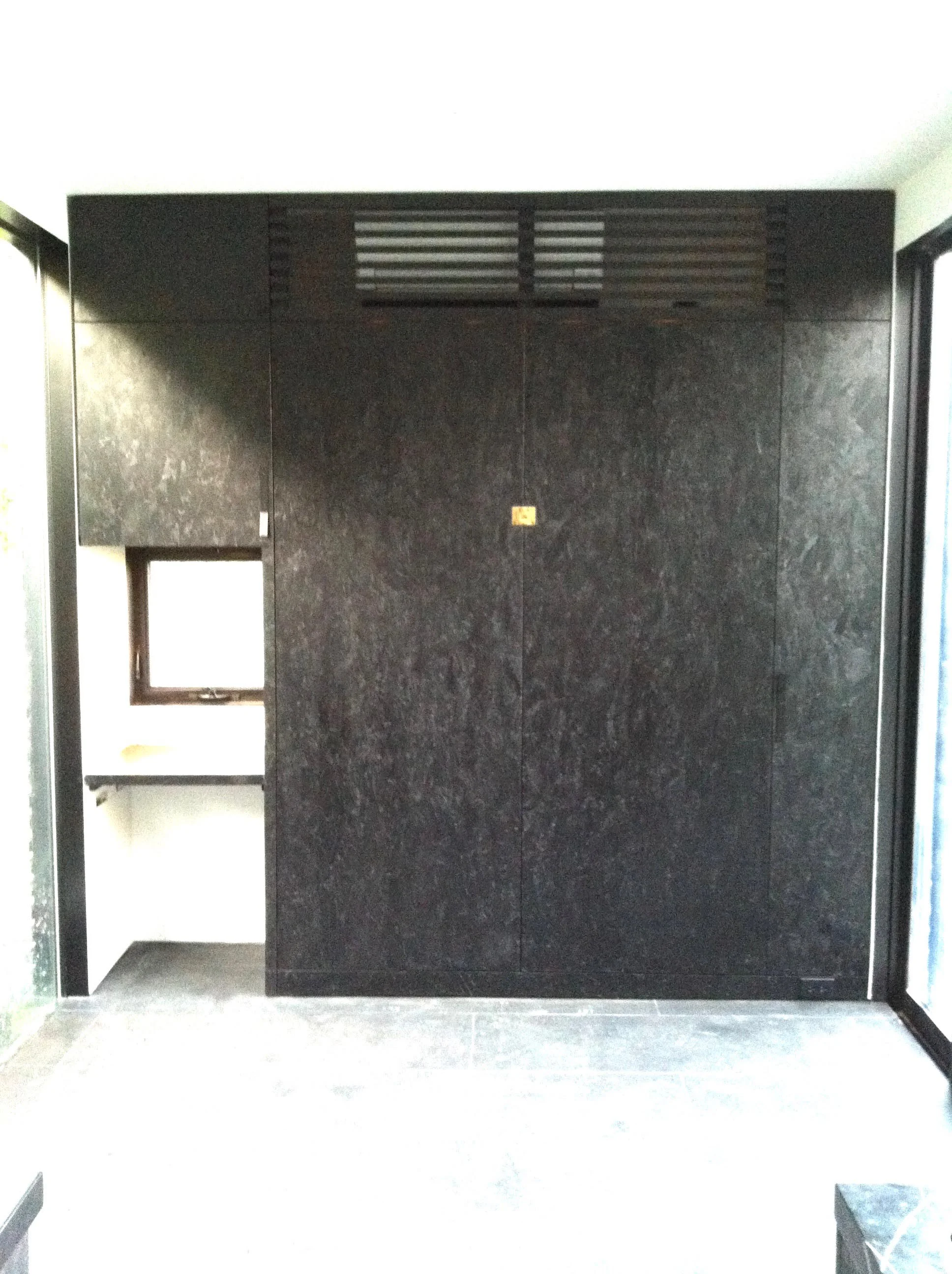 Custom murphy bed with stained osb face