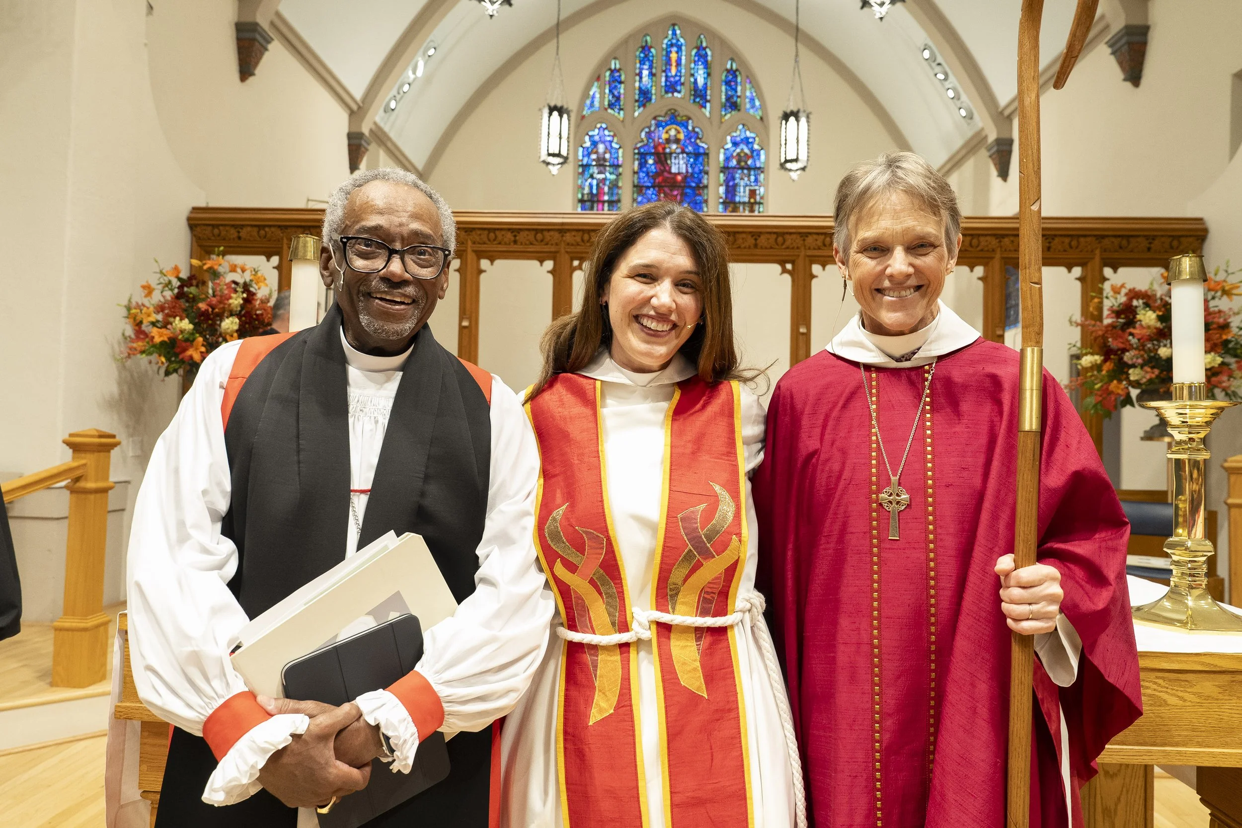  The Most Rev. Michael Curry, Hillary, and Bishop Mariann Budde pose in St. Columba’s church after Hillary’s installation as their rector. 