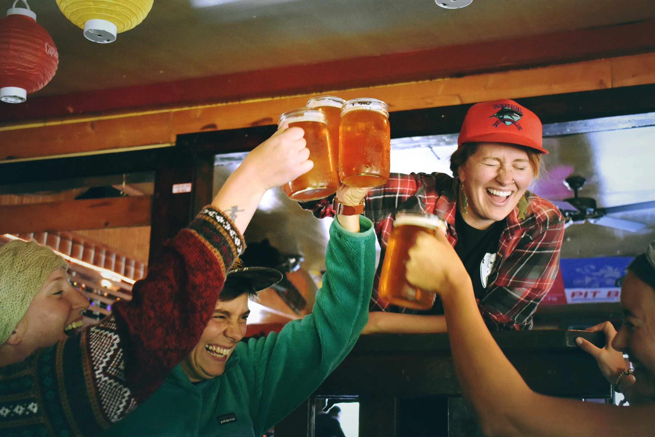 Young people partying and raising their glass