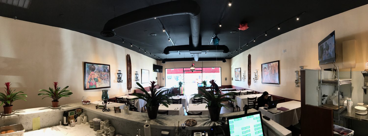  A panoramic shot from the kitchen looking out into the dining room at All India Cafe in Glendale. 