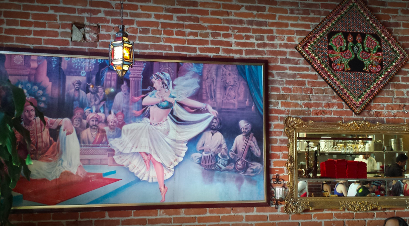  Artwork hanging on the brick wall at All India Cafe in Pasadena. 