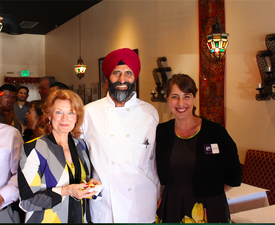  The owner of All India Cafe with members of the Glendale community. 