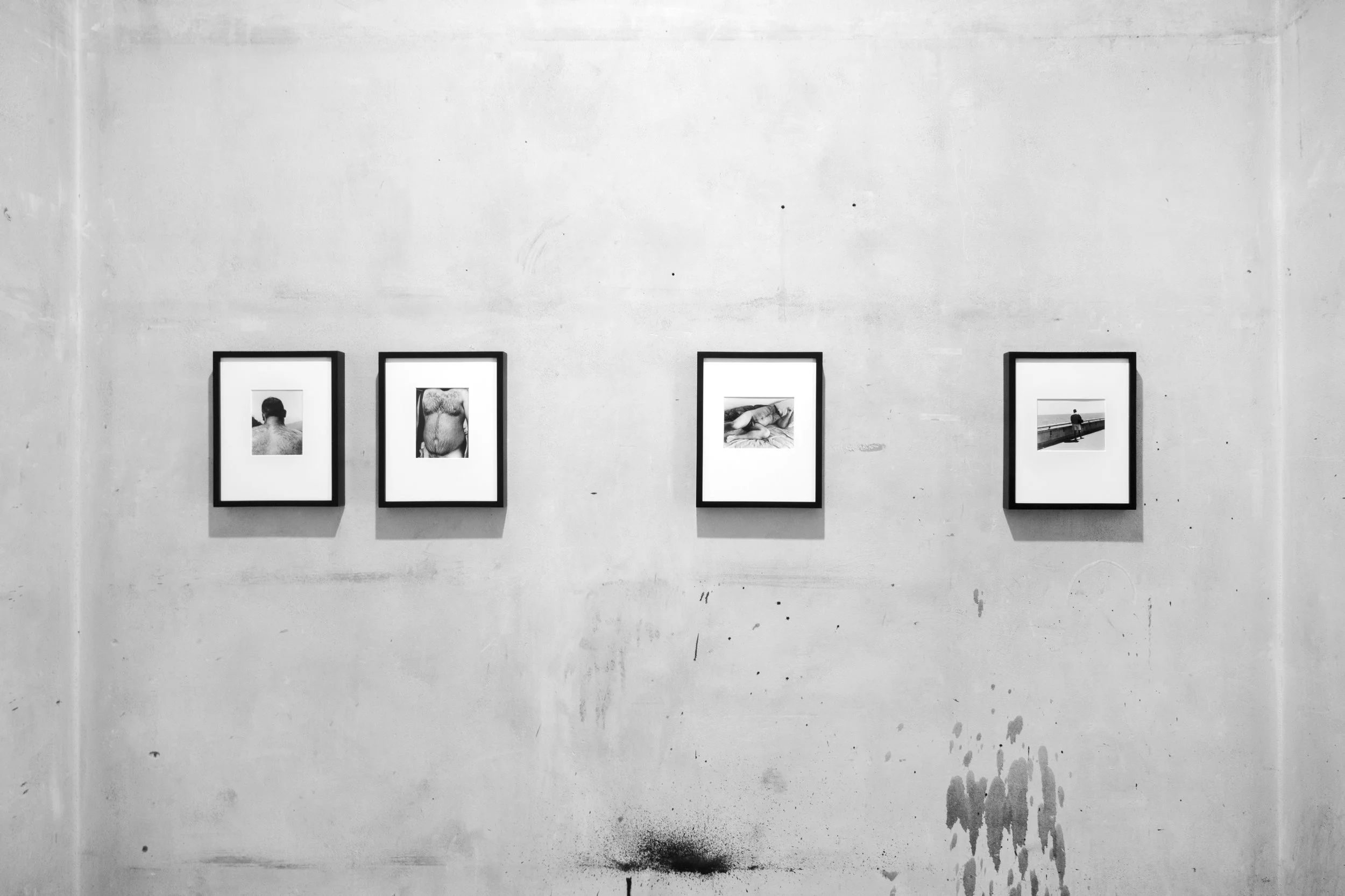 Installation view. L to R: "Mountains", "River", "Reclining nude", "Sea." All works over-matted, silver gelatin prints in 8.5x11in. painted wood frame. 