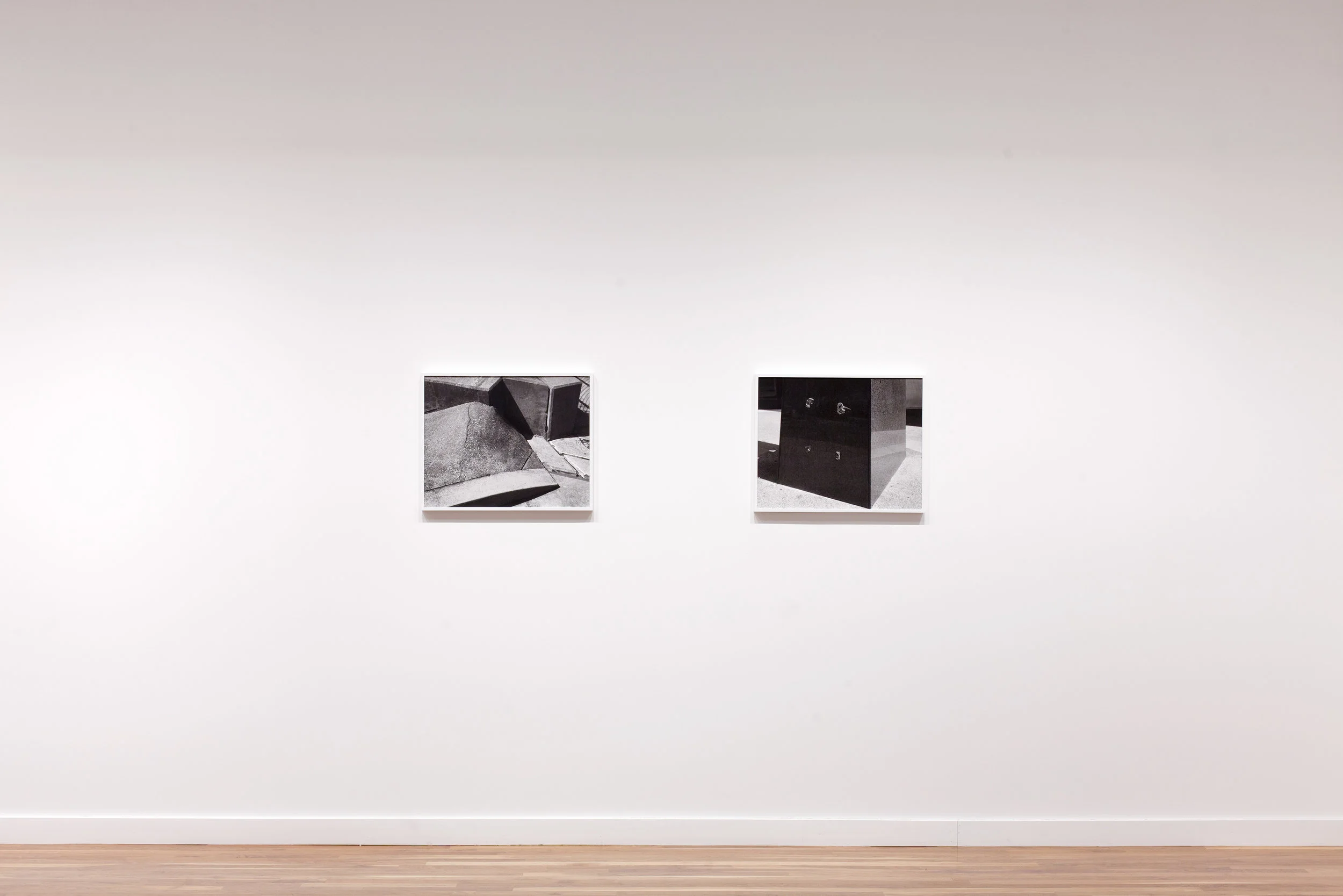 Installation view. L to R: "Separation" and "Monument." Both works 20x25, Archival pigment prints in painted wood frames, 2015.