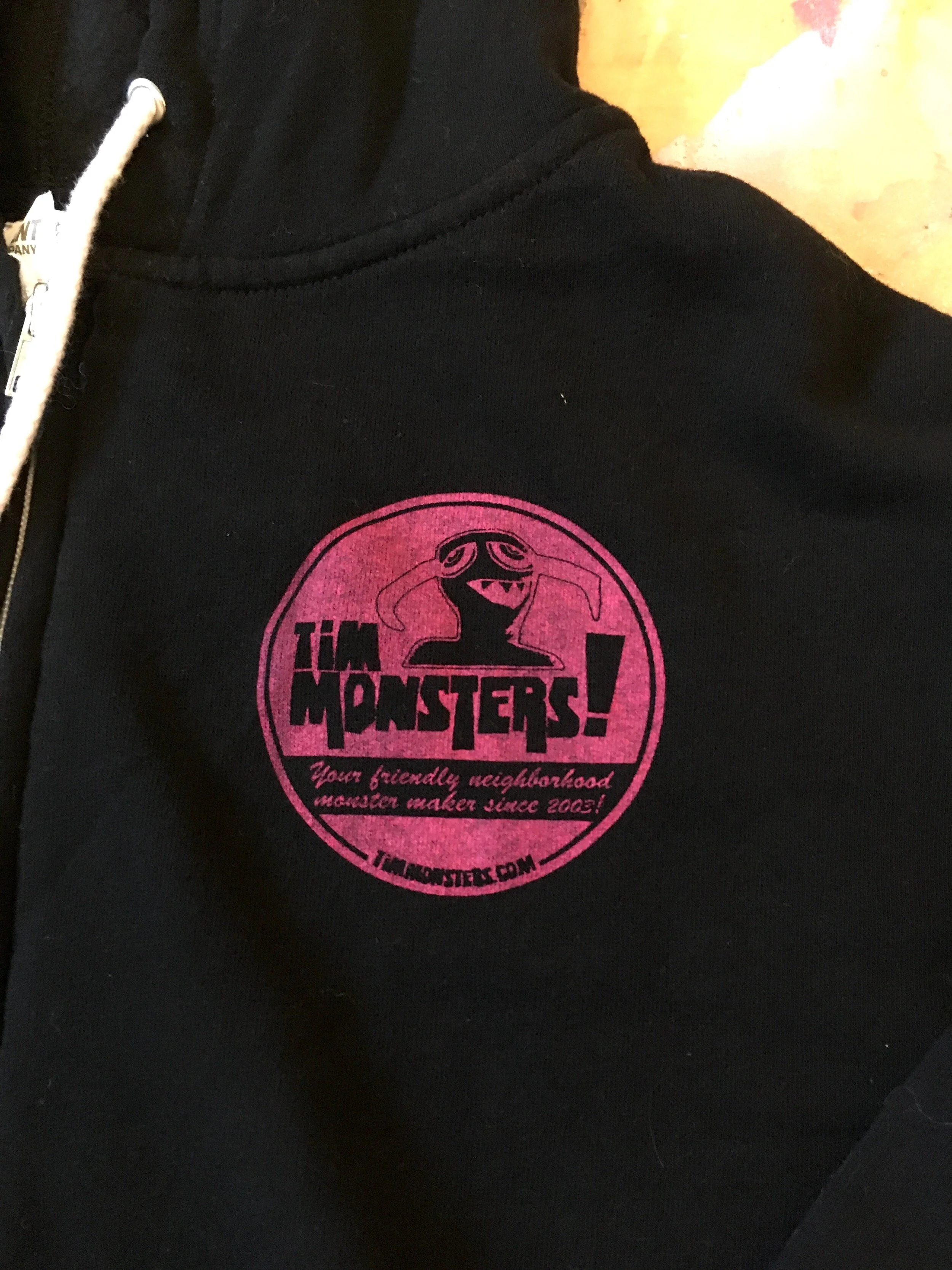 TM BLACK SCREEN PRINTED HOODIE FRONT 2.JPG
