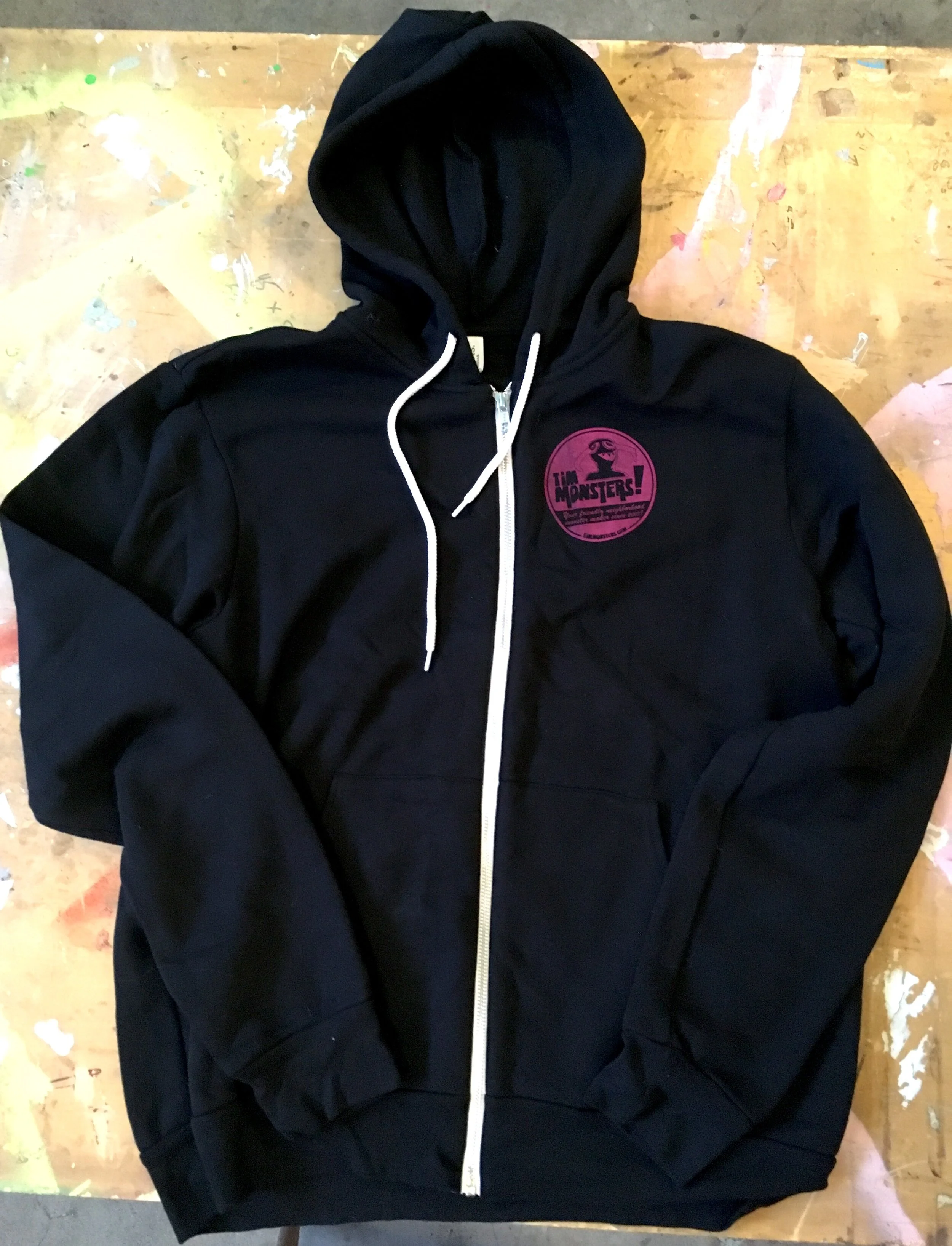 TM BLACK SCREEN PRINTED HOODIE FRONT BELLA CANVAS.JPG