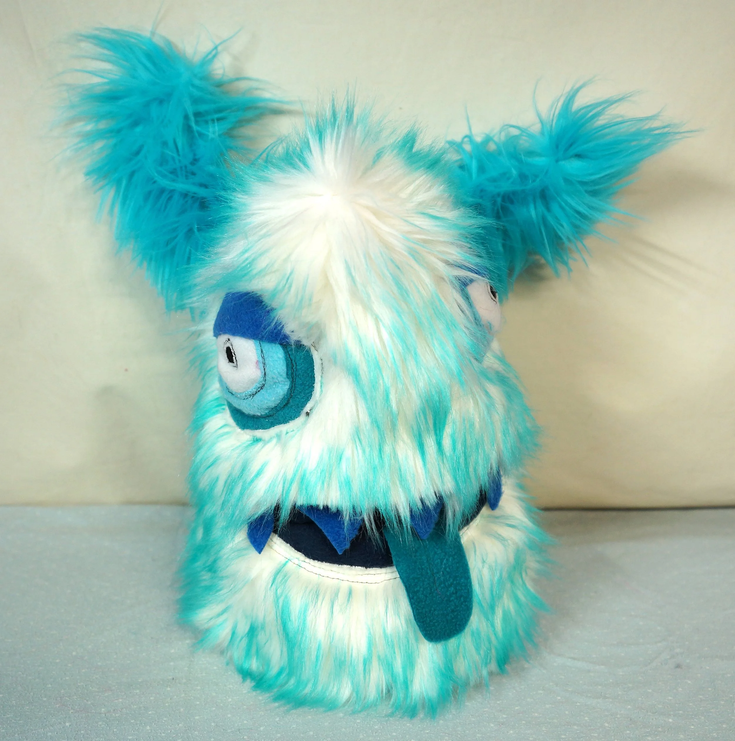 LARGE SNOW MONSTER WITH POCKET MOUTH, HORNS