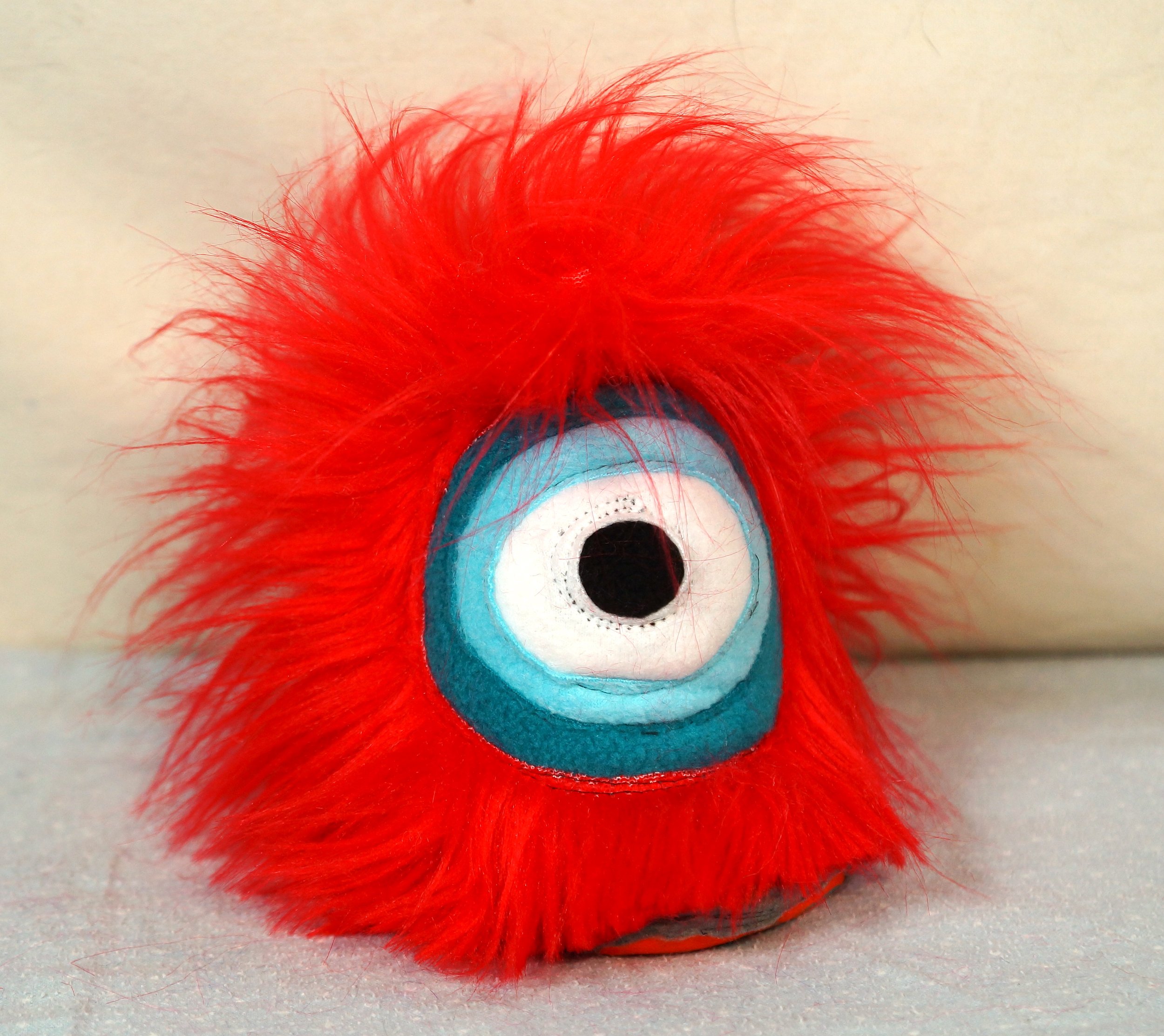 SMALL RED ONE EYED MONSTER