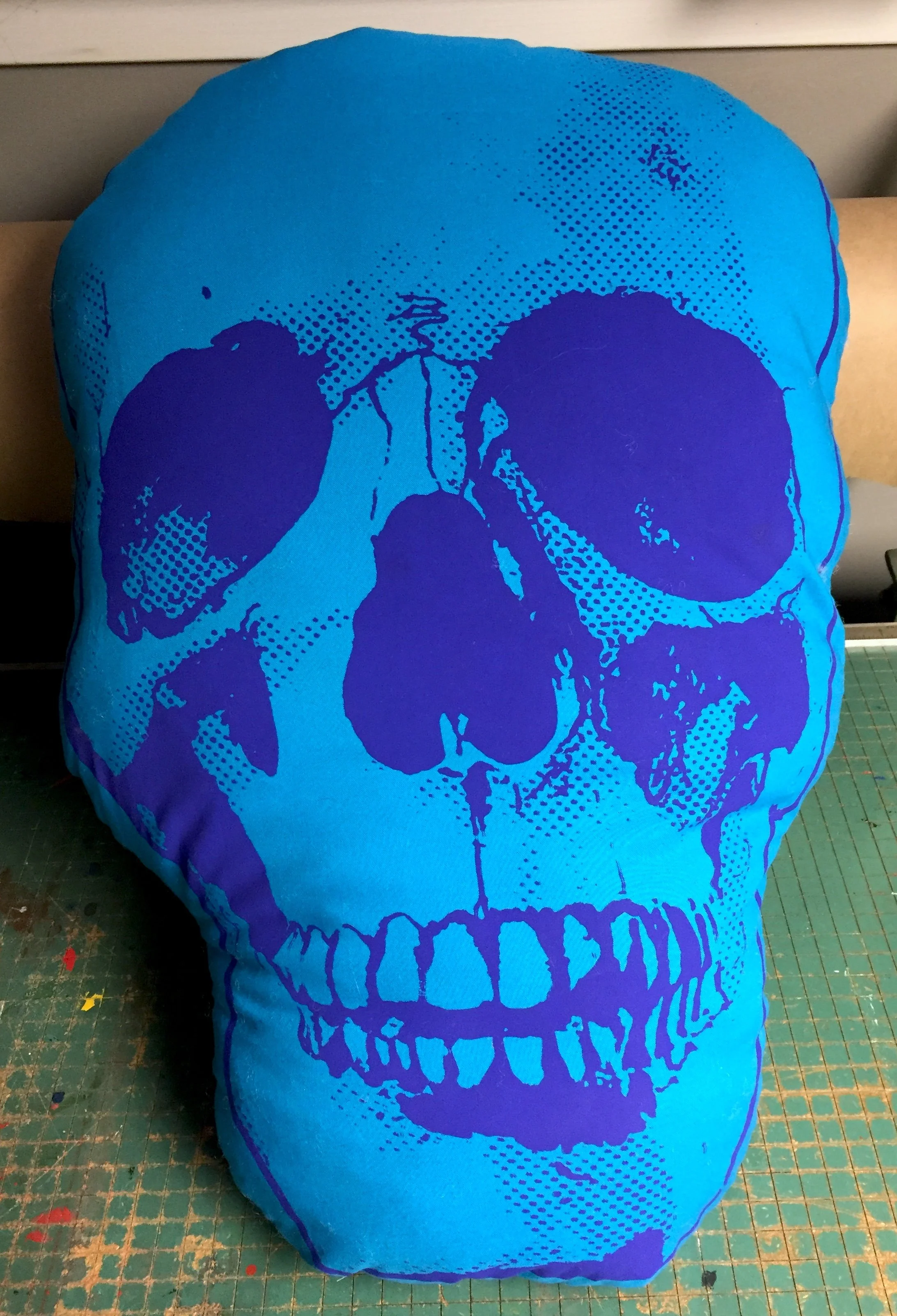 NEON BLUE SCREENPRINTED SKULL PILLOW