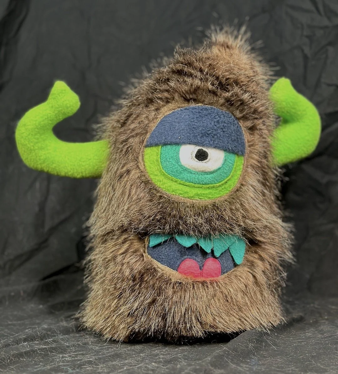 LARGE BROWN STRIPED ONE EYED MONSTER WITH HORNS POCKET MOUTH Copy 
