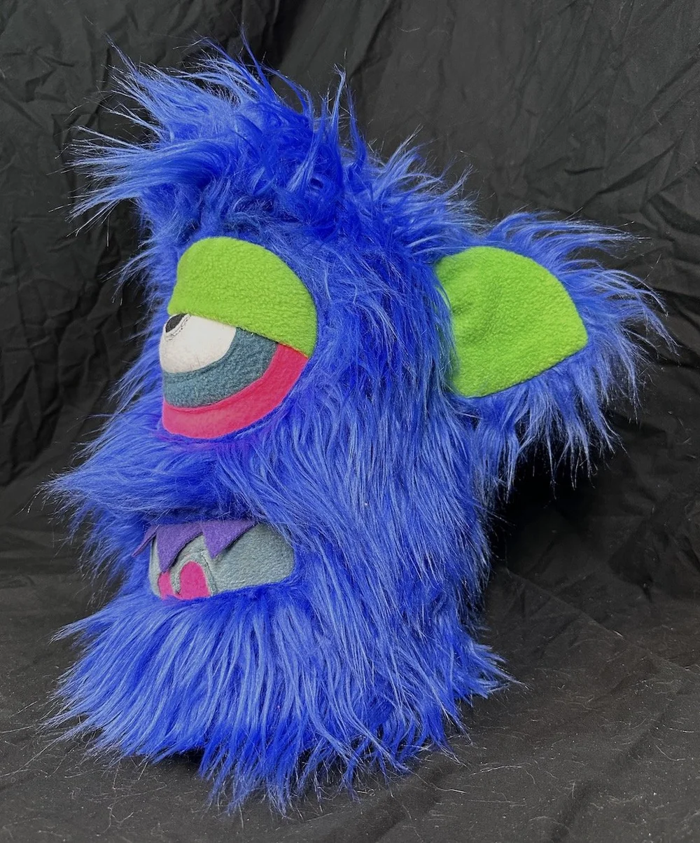 LARGE PINK ONE EYED MONSTER WITH HORNS, POCKET MOUTH & SLIME — TIM