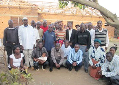 Lameck, one of the SAFE staff, prayed with several local village pastors (kneeling in this photo), to have an outreach meeting with 25 chiefs (mostly Muslim) from the Kawiya villages. They decided to show them the "Magdalena" file that portrays Jesus' love and respect for women. Muslim men regard women as second-class people in the community. After the film it was awesome for Lameck to hear chiefs (standing in above photo) praying and asking God to forgive them for their wrong attitudes. One chief commented, "What we saw in the film is what is happening in our communities … so we would love for you would show the film to all the people we are looking after so they would also turn from this behavior as we have now decided to do."