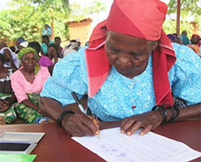 Fertilizer and seed money was given to 2,017 registered gogos in three regions of Malawi in time for planting their gardens in December. The price for fertilizer had quadrupled. But, because of our gogo sponsors, SAFE was able to meet their need--enough for two bags of fertilizer and seeds of their choice (pigeon peas, ground peanuts or soy). The gogo pictured is signing to receive her fertilizer and seed money. The food situation was so bad for the whole country that if there had not been more rain, the situation would have become dire for the April/May harvest. ECD Director, Mary Phiri reported, "Last night we had some rains here in Zomba town… praying the maize around here will be saved."