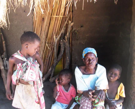 The little boy in the pink shirt is John Kangombe. John was discovered by our staff at one of our Childcare Centers in Katchindamoto. malnourished and needing to be tested for HIV/AIDS, His mother has three children and also takes care of her late sister's children and her granny. She does piece work to feed them. Because the family often goes to bed hungry, the mother sent him to our CBCC to get the porridge served daily to the children. We are providing John's family with immediate assistance.