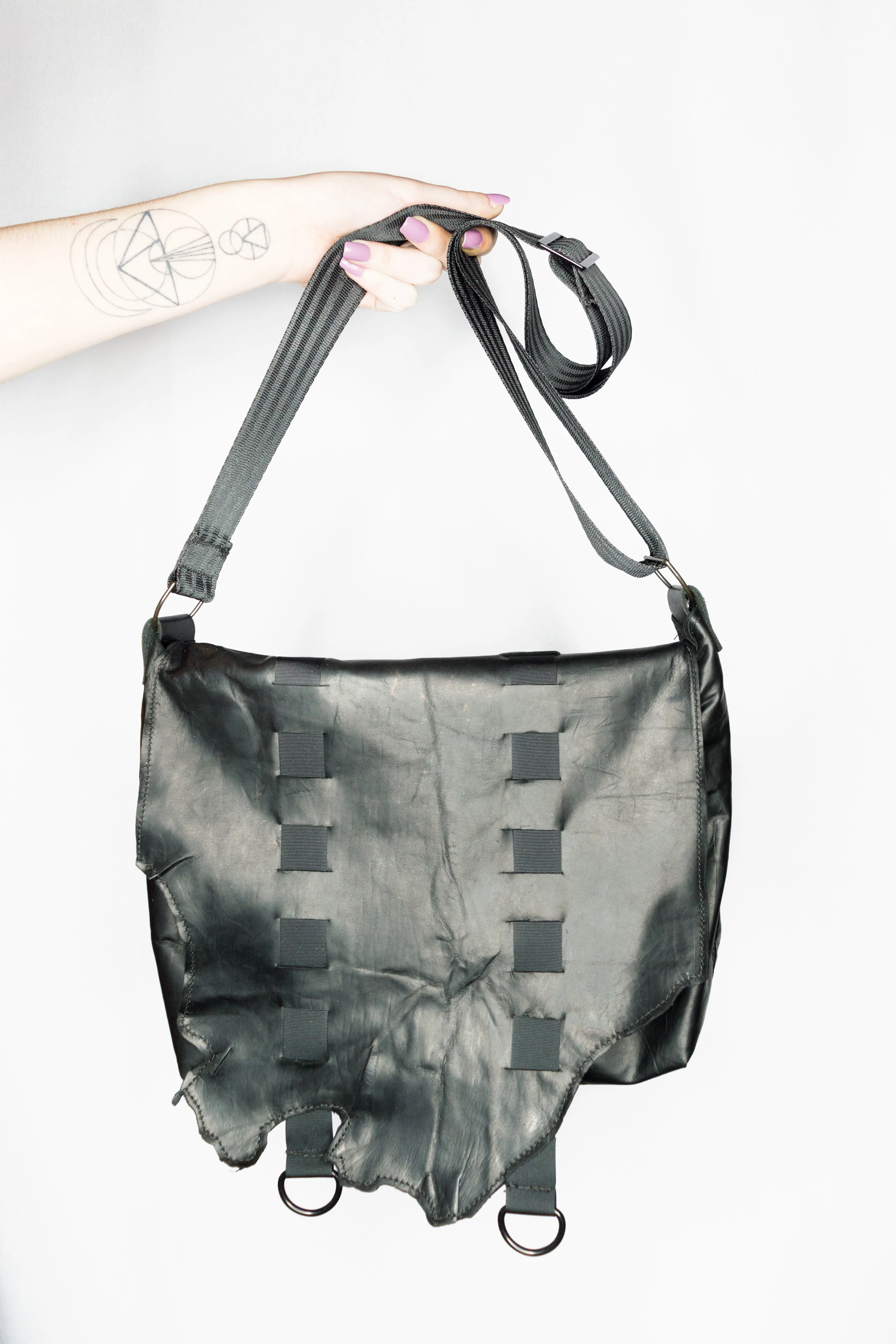 blackoiledtape_purse_hand.jpg