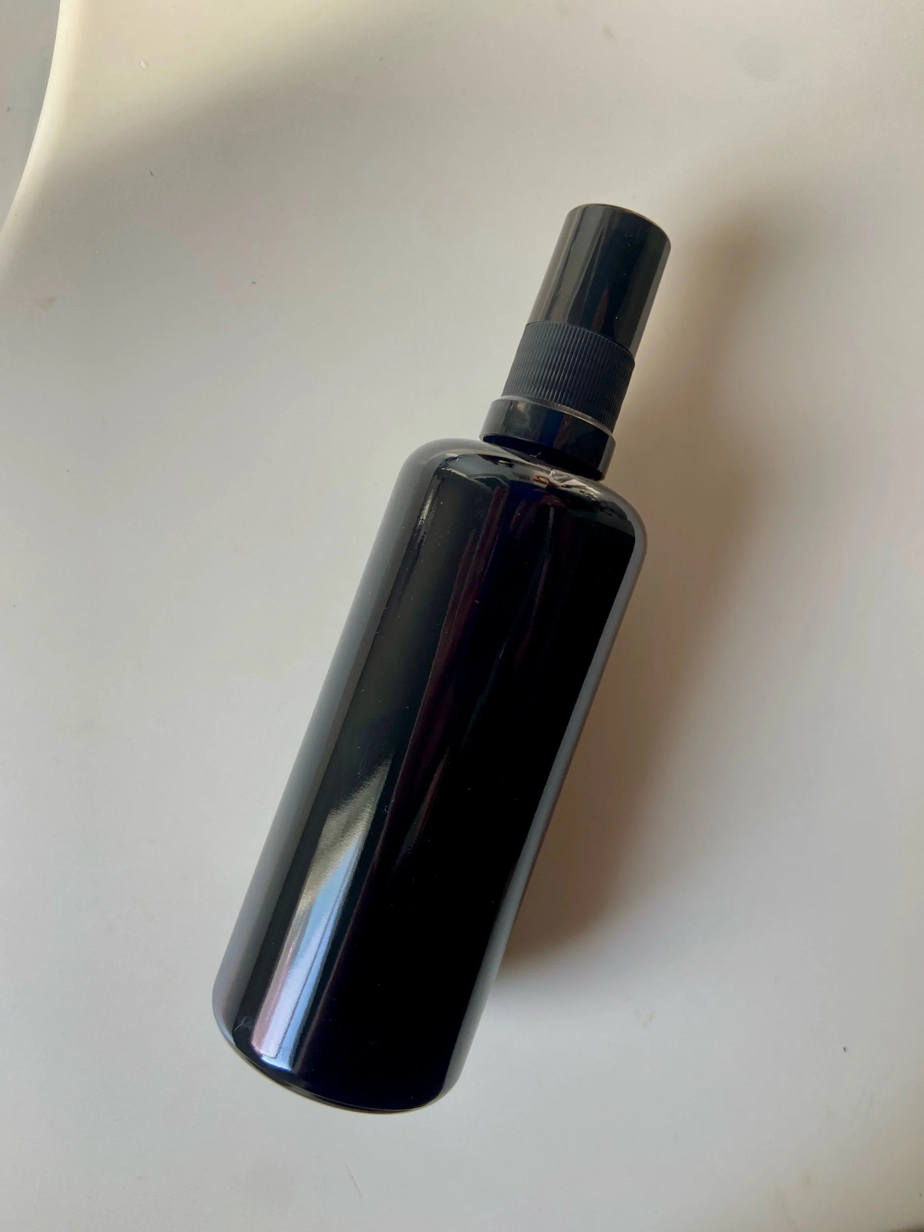 Blue Yarrow Hydrosol artisan facial mist in ultraviolet glass bottle