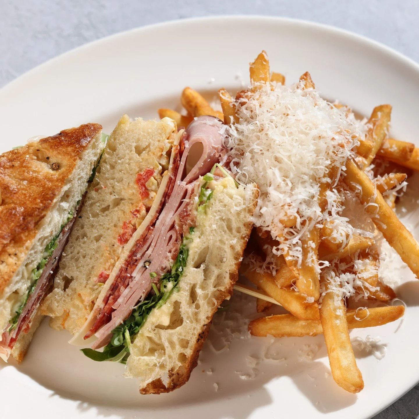 There's nothing quite like a warm sandwich and Parmigiano-Reggiano herb fries for lunch on a chilly day. #TheItalian ✨ 

&bull; Red Hog pepperoni &bull; Broadbent country ham &bull; mortadella &bull; arugula &bull; provolone, pepper &amp; olive relis