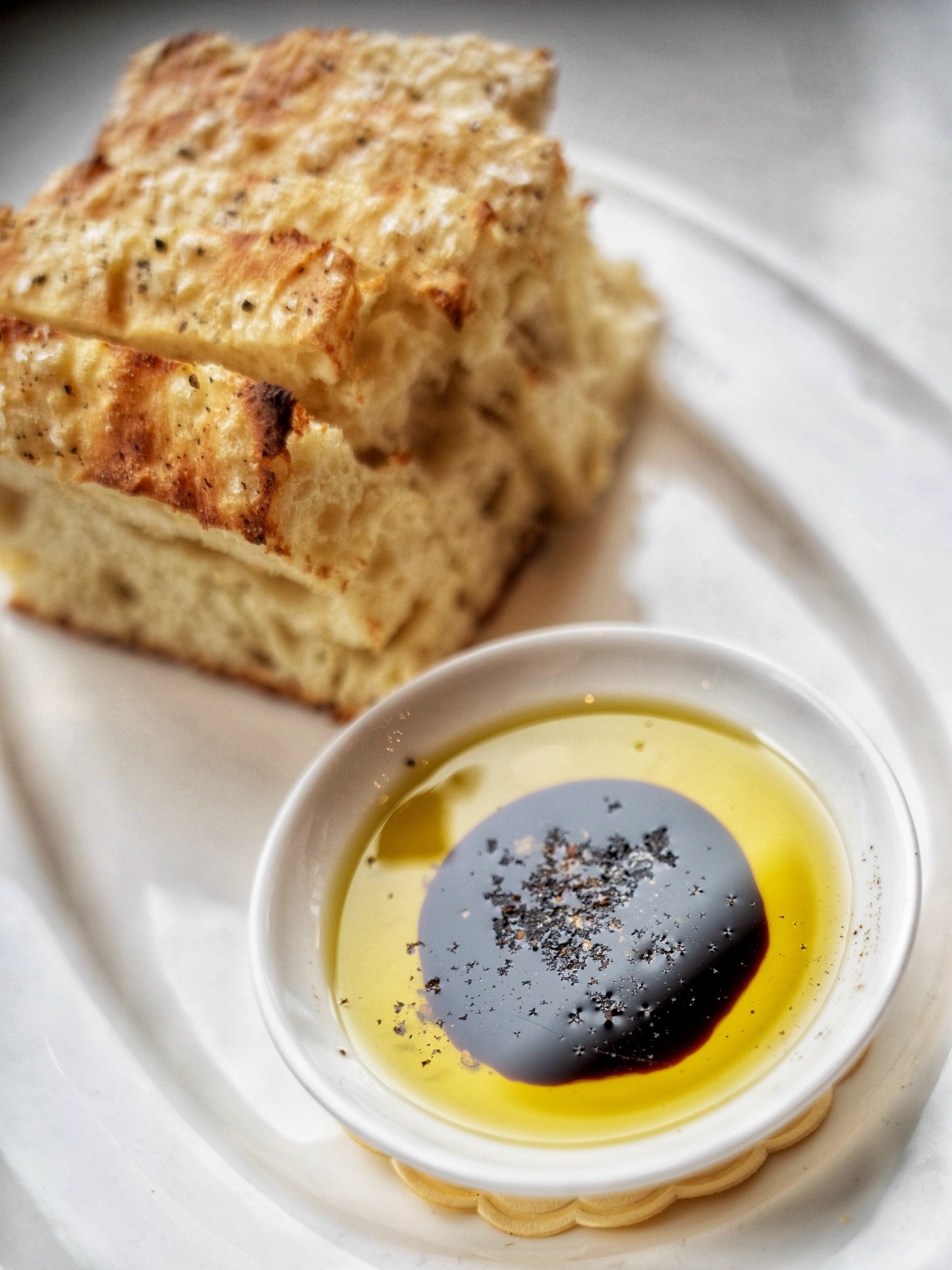 Everything we do starts with a respect for the ingredient. Our house focaccia is a perfect example of that. We serve it with estate-grown extra virgin olive oil and San Giacomo saba, seasoned simply with sea salt.&nbsp;

It&rsquo;s the cucina povera 