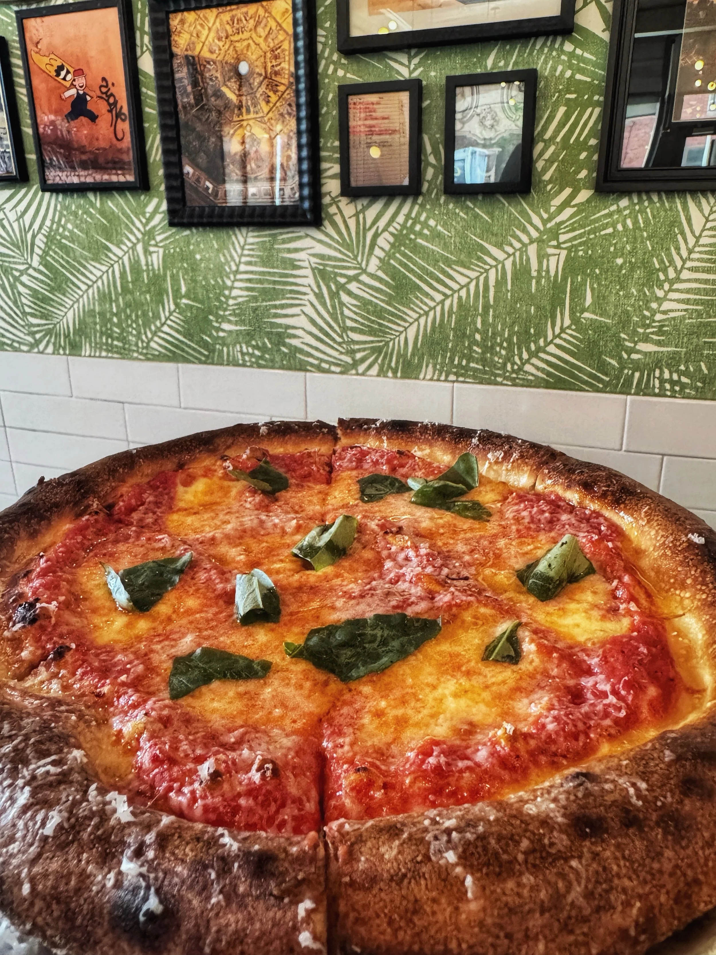 In 1889, Queen Margherita of Savoy was served a pizza in Naples featuring the colors of the Italian flag: red, white, and green. A simple gesture of national pride that became the global benchmark for pizza.

We follow that same three-color tradition