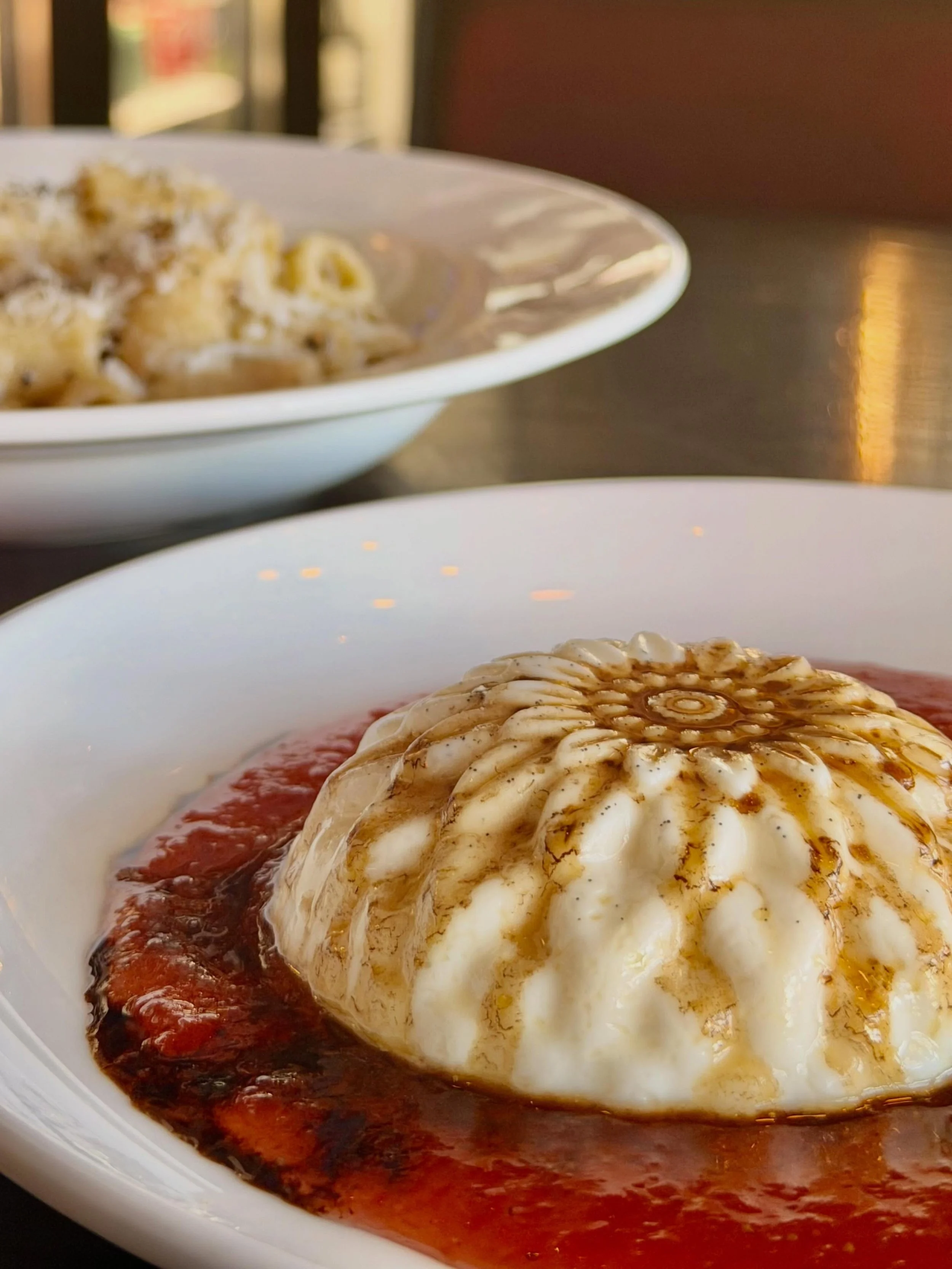 In Italian, panna cotta translates to &ldquo;cooked cream.&rdquo; We&rsquo;ve given our version a regional signature by using Capriole goat cheese from just across the river in Greenville, Indiana. It&rsquo;s served with fresh strawberries and a driz