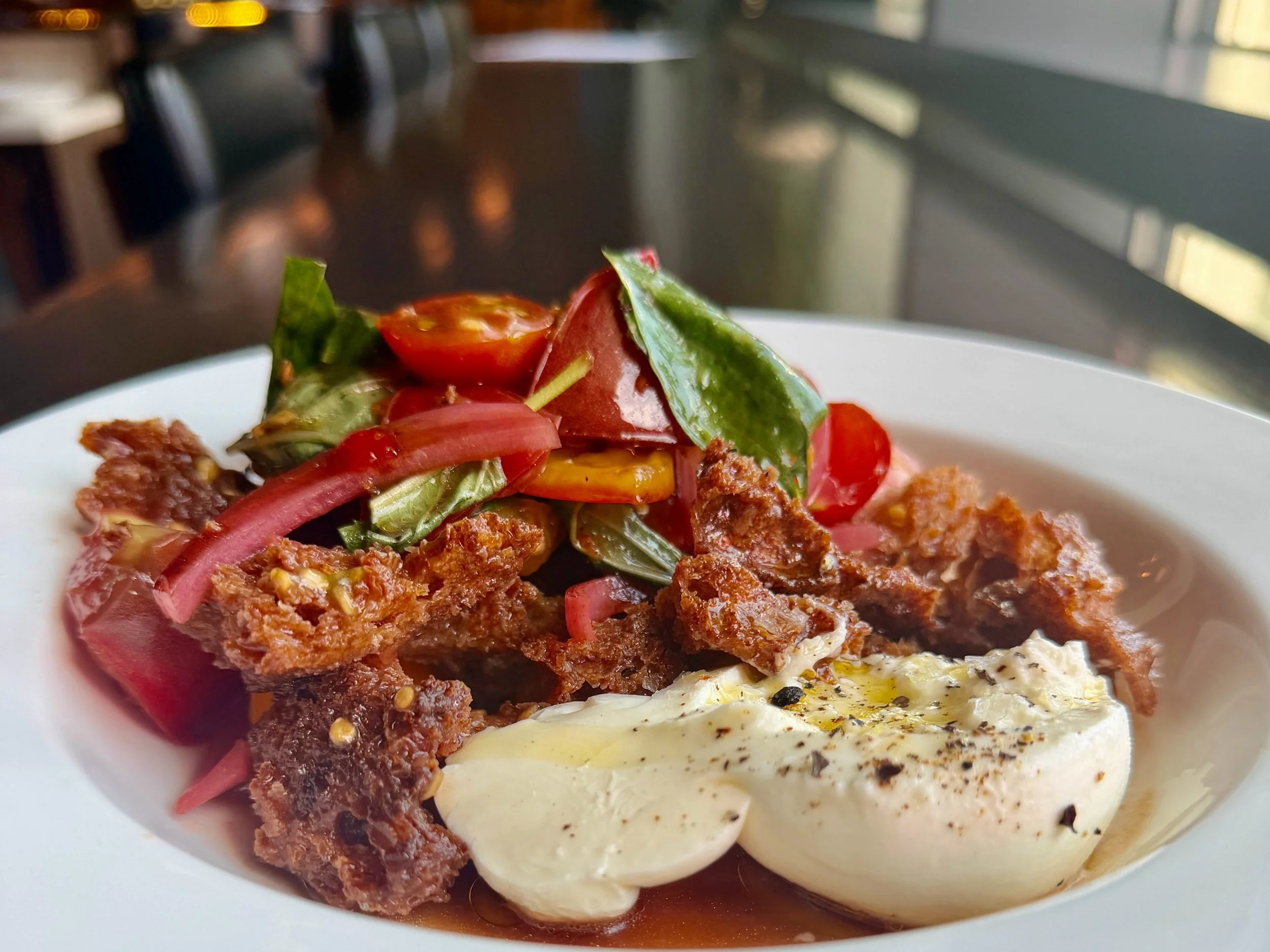 We know our Panzanella is a customer favorite. And now that it&rsquo;s back on the menu, we&rsquo;ve also added a Half Panzanella option during lunch service.

Heirloom tomatoes, Gr&auml;ńde burrata, torn croutons, pickled red onions, San Giacomo bal