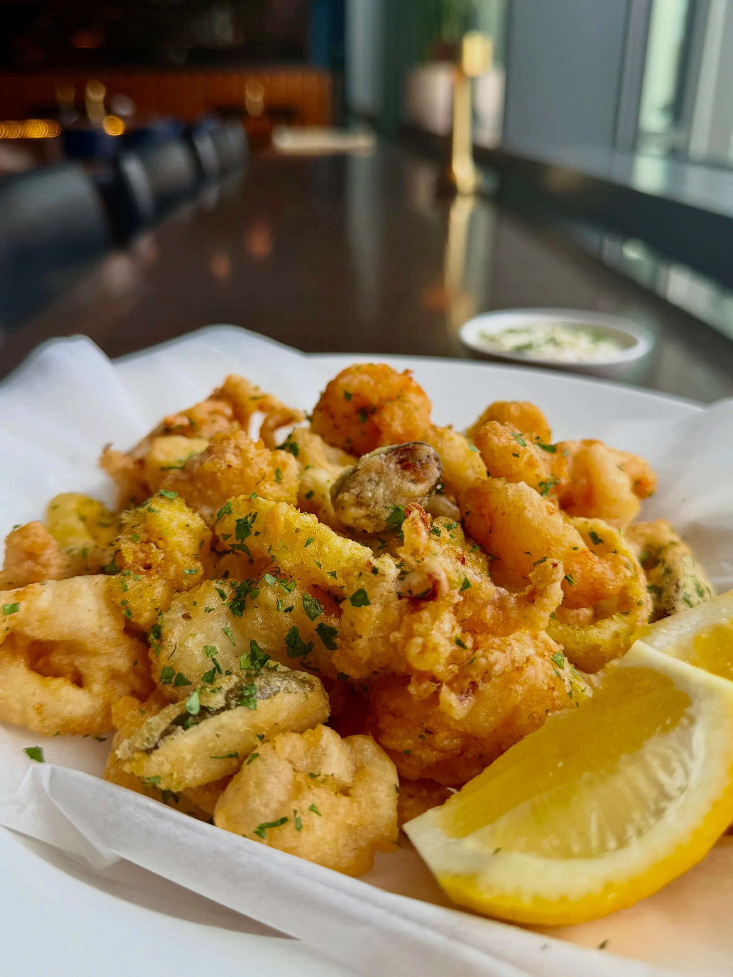 Fritto Misto (&ldquo;mixed fried&rdquo;) has been lovely to snack on during Ferragosto. This classic coastal fare mixes lightly fried shrimp, calamari, banana peppers, and caperberries.

Crispy, crunchy, salty, and bright. And only available for just