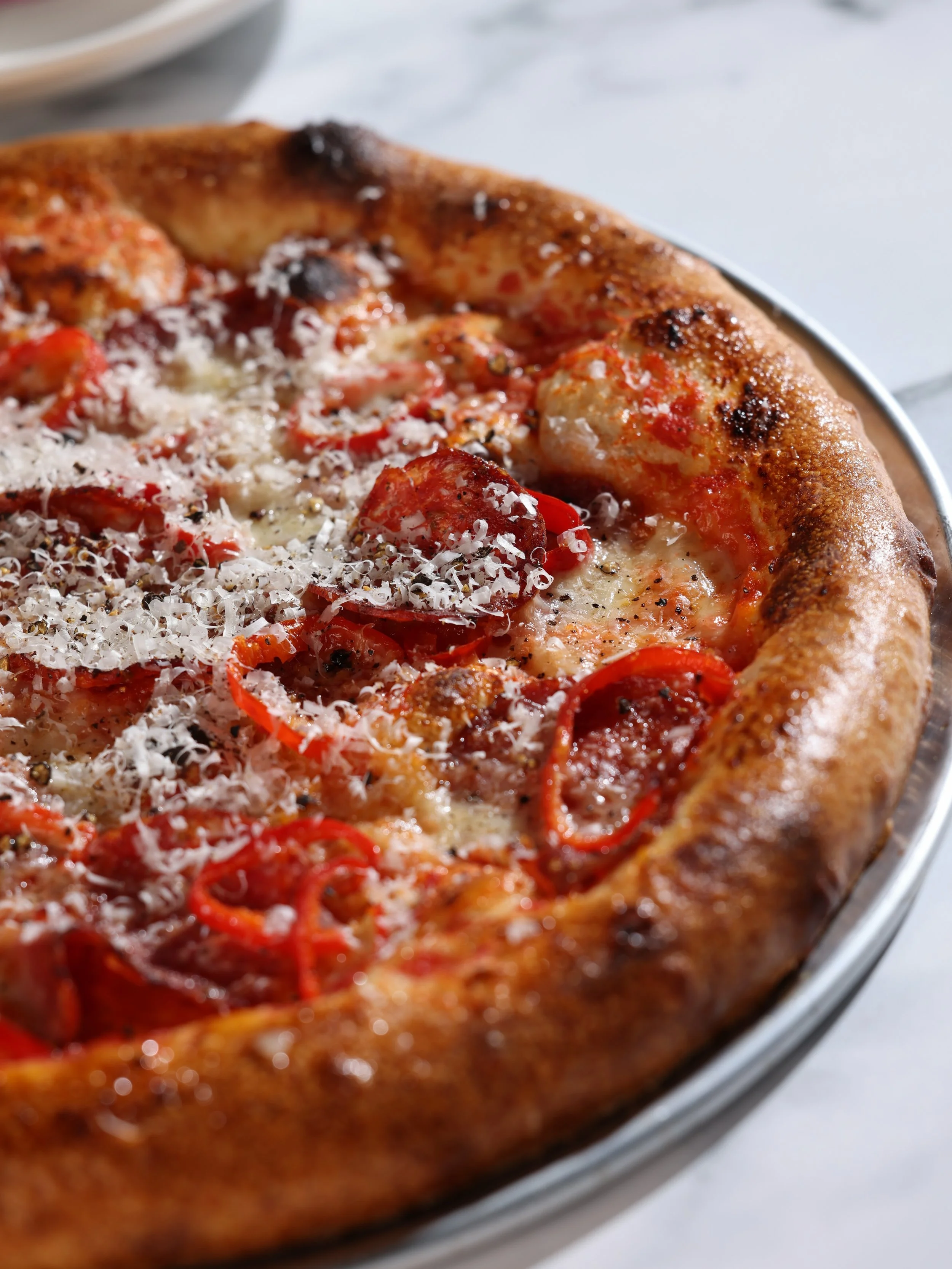 Why do we call it *Fancy* Pepperoni? Well, other than it sounding fun, we think the addition of calabrian chili honey and pickled fresnos to the @redhogbutcher pepperoni, mozzarella, and tomato really make it something else.

Share a pizza at our bar