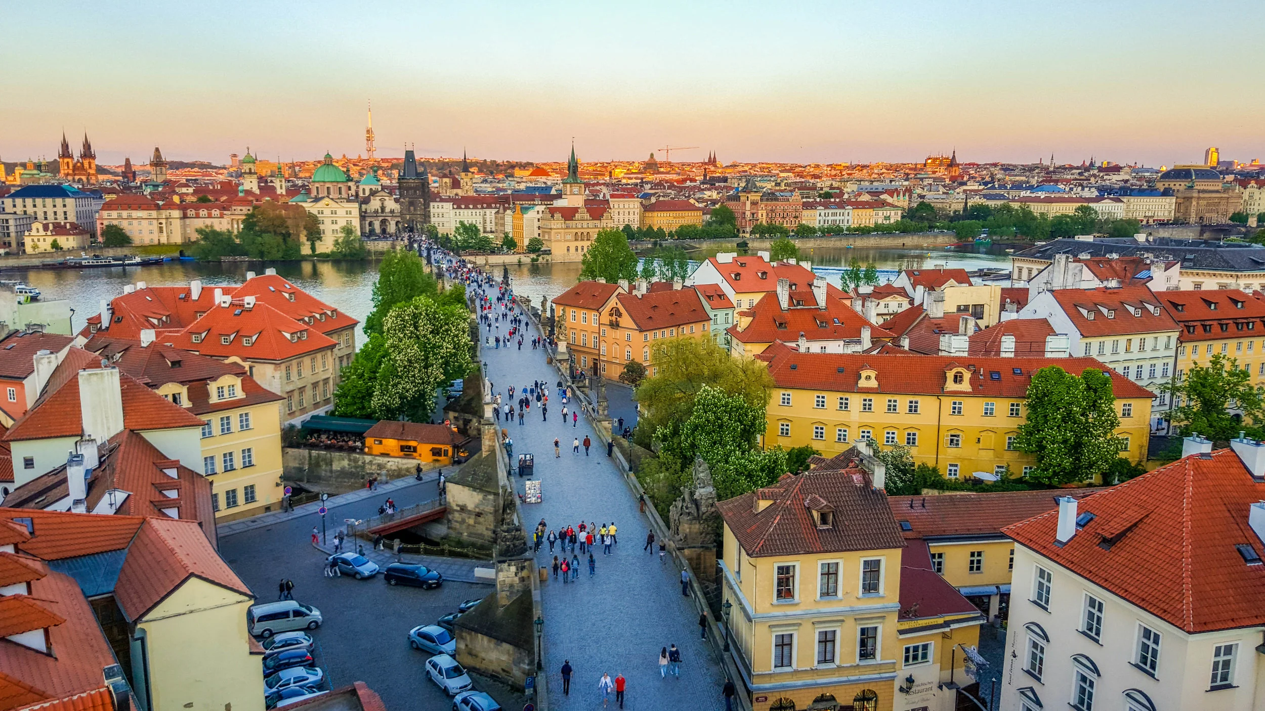 View of Charles Bridge from the Lesser Town Bridge Tower at dusk.