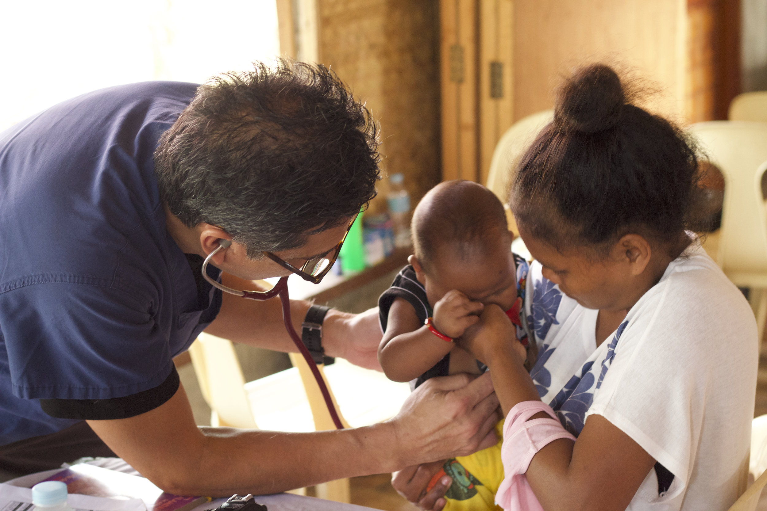 Grace's cousin, Dr. Lino DeGuzman, was also the age of this young patient when he emigrated from the Philippines. A gastroenterologist in Newport Beach, he has also returned to help the people of his homeland.