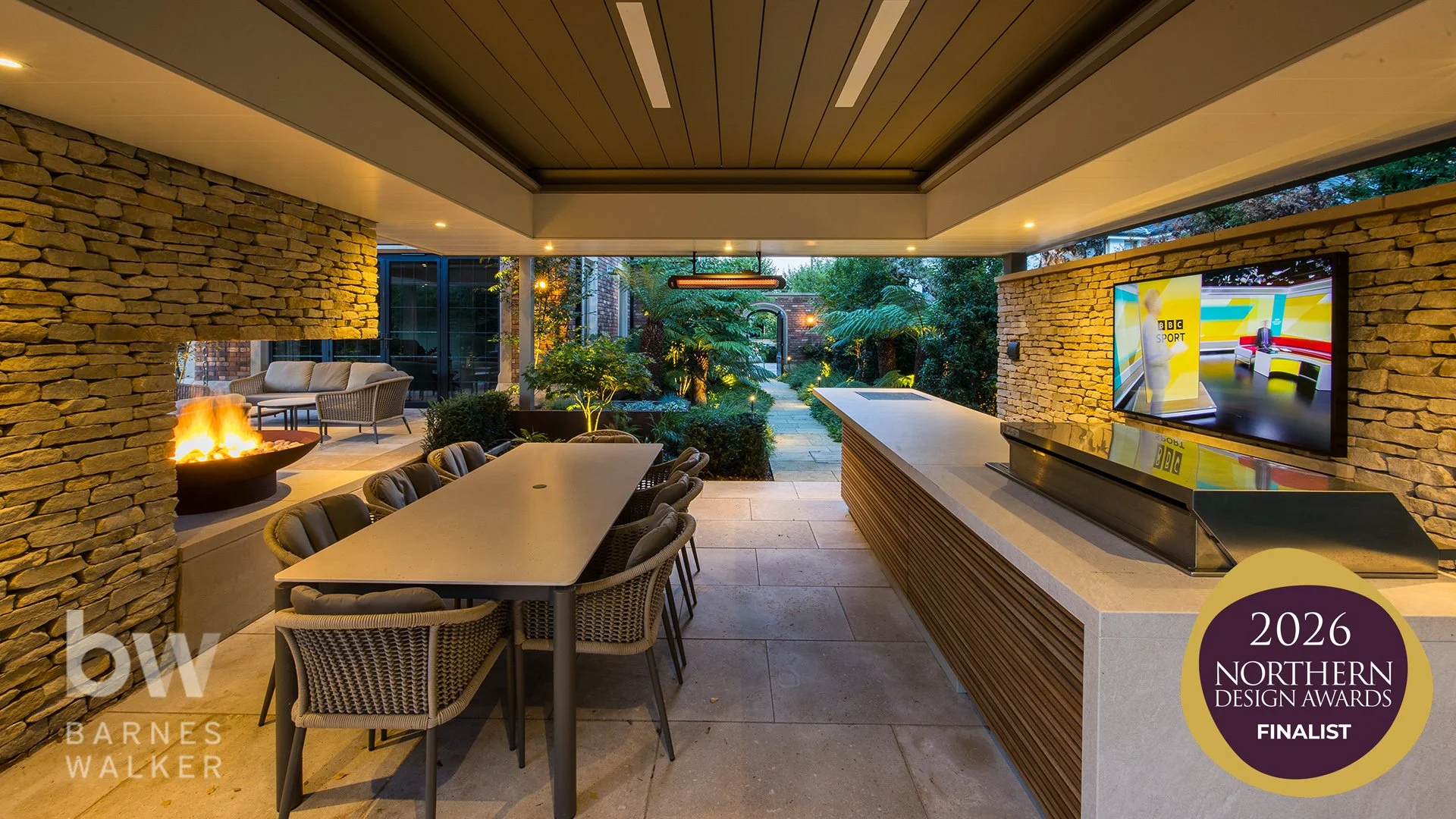 External living details, water feature with reflection trough, illuminated floating steps, outdoor kitchen and covered entertainment area.

Designed and delivered alongside a beautiful contemporary home by Maison IOM, the gardens feature elegant ston