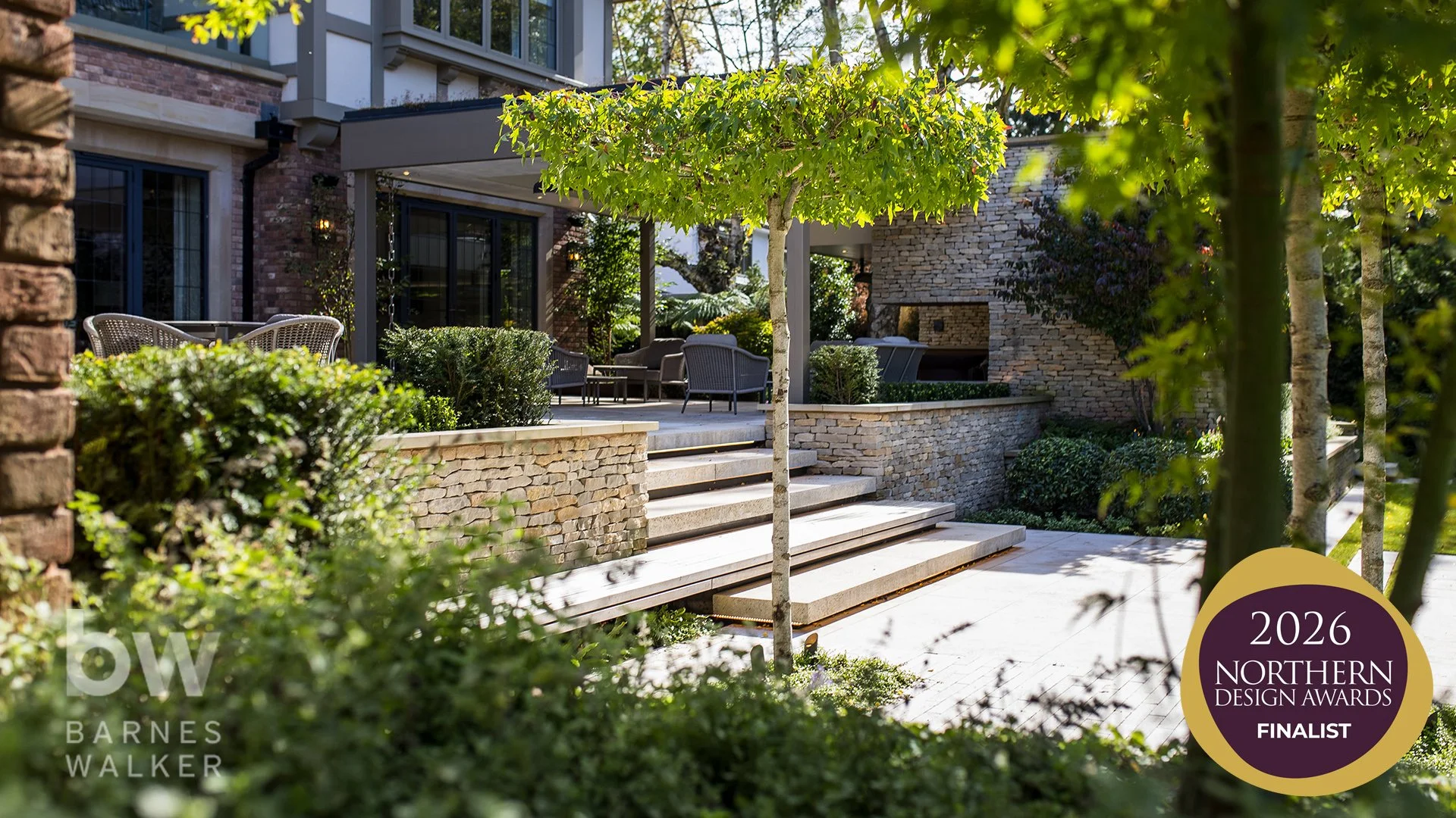 Garden views.

Designed and delivered alongside a beautiful contemporary home by Maison IOM, the gardens feature elegant stone terraces, bespoke water features, sophisticated lighting and richly layered planting, creating a series of exceptional outd