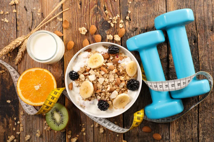 muesli-with-fruits-and-yogurt,-meter-and-dumbbell,-diet-food-concept-1175709203_8660x5773.jpeg
