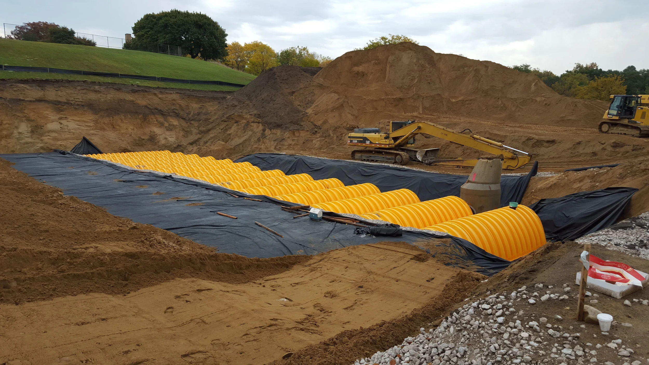 Construction of the retention basin under Mary Waters Park. It holds and slowly filters up to 720,000 gallons of stormwater. Photo courtesy of Elaine Isely.
