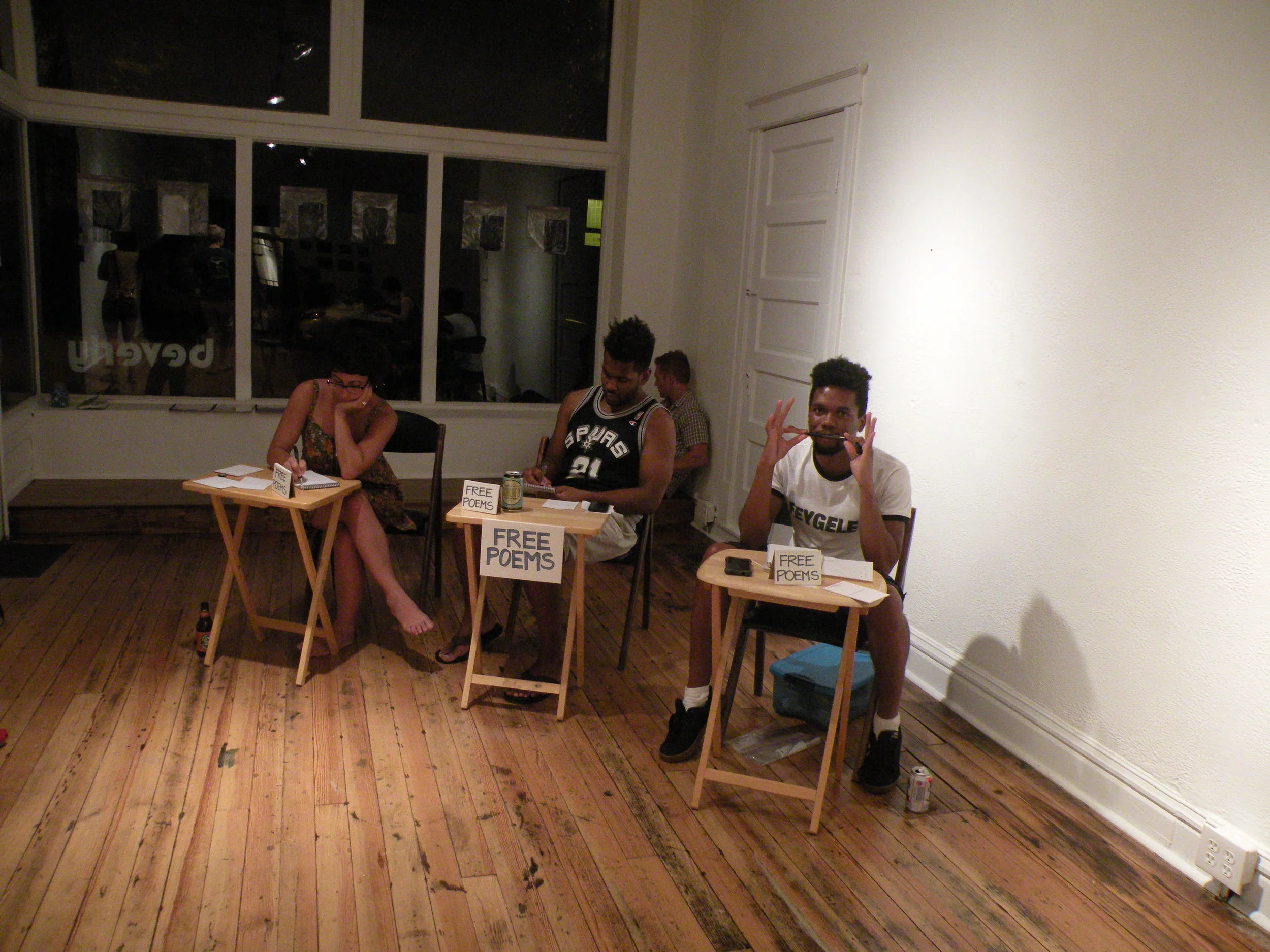 Poets work their booths at a tile-making event at Beverly. Photo by Laurencia Strauss