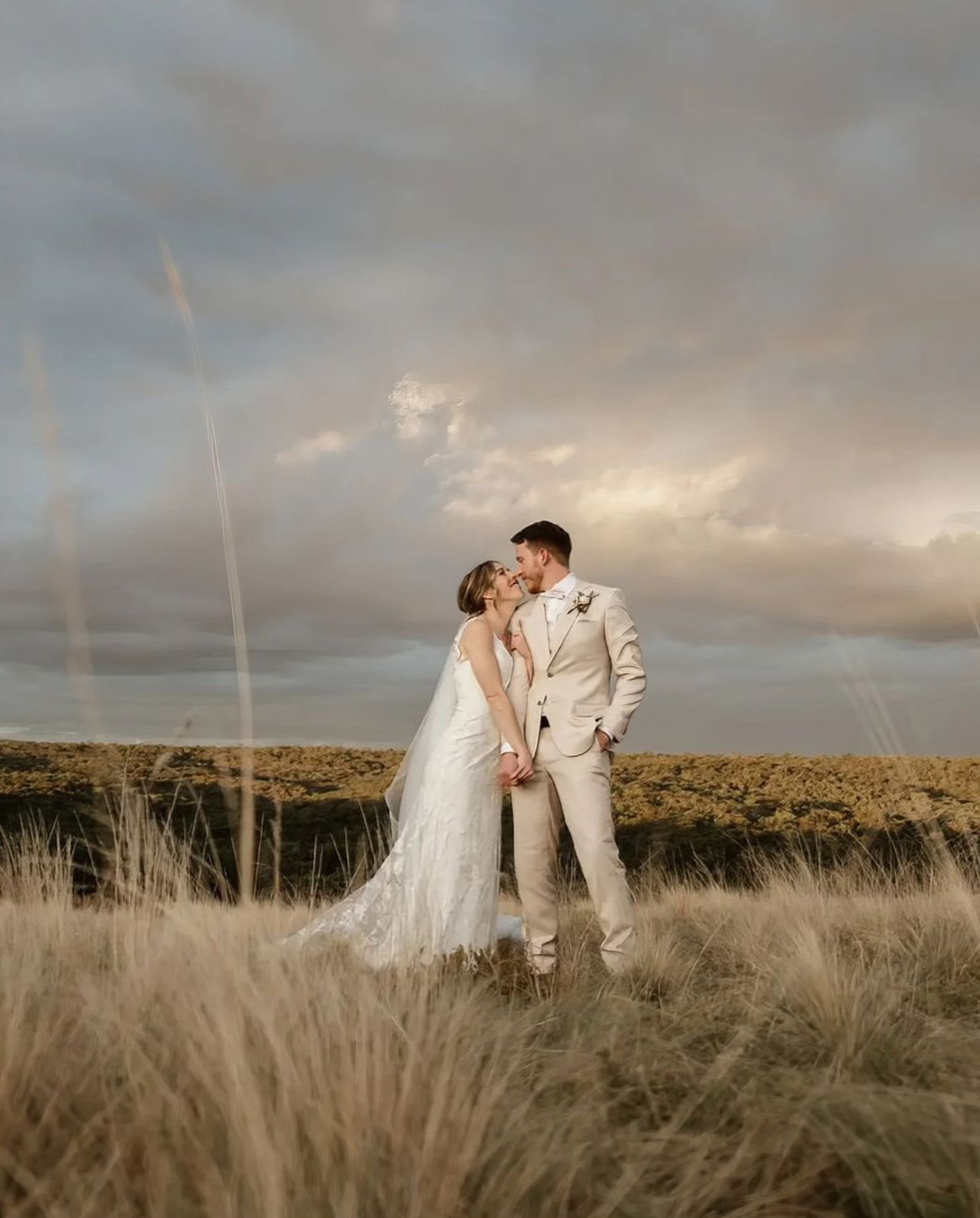 Where the grass meets the sky, our stunning bride Lyra glows in her customized Aster gown ♡ #OpenFields #MadeInMelbourne #SarinaTavraBrides
