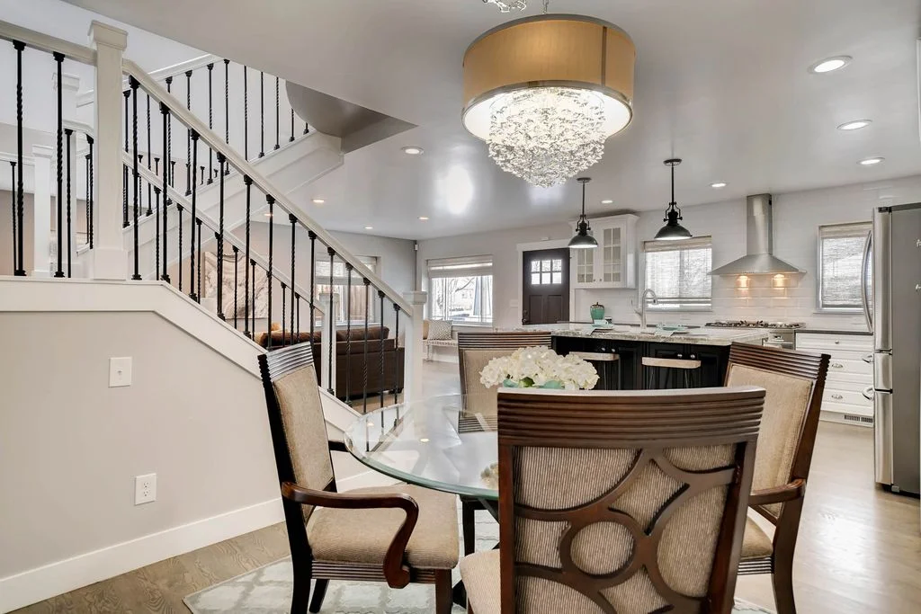 View of the dining area west of the kitchen, separated by the new staircase.