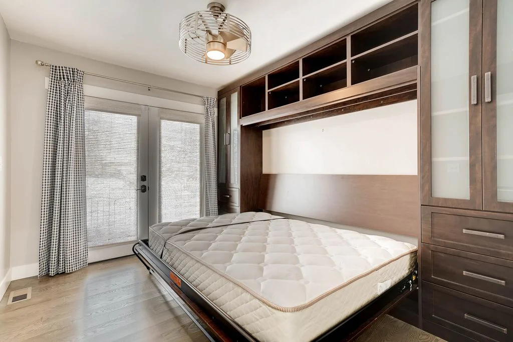 View of the open Murphy bed which transforms the office into a guest room.