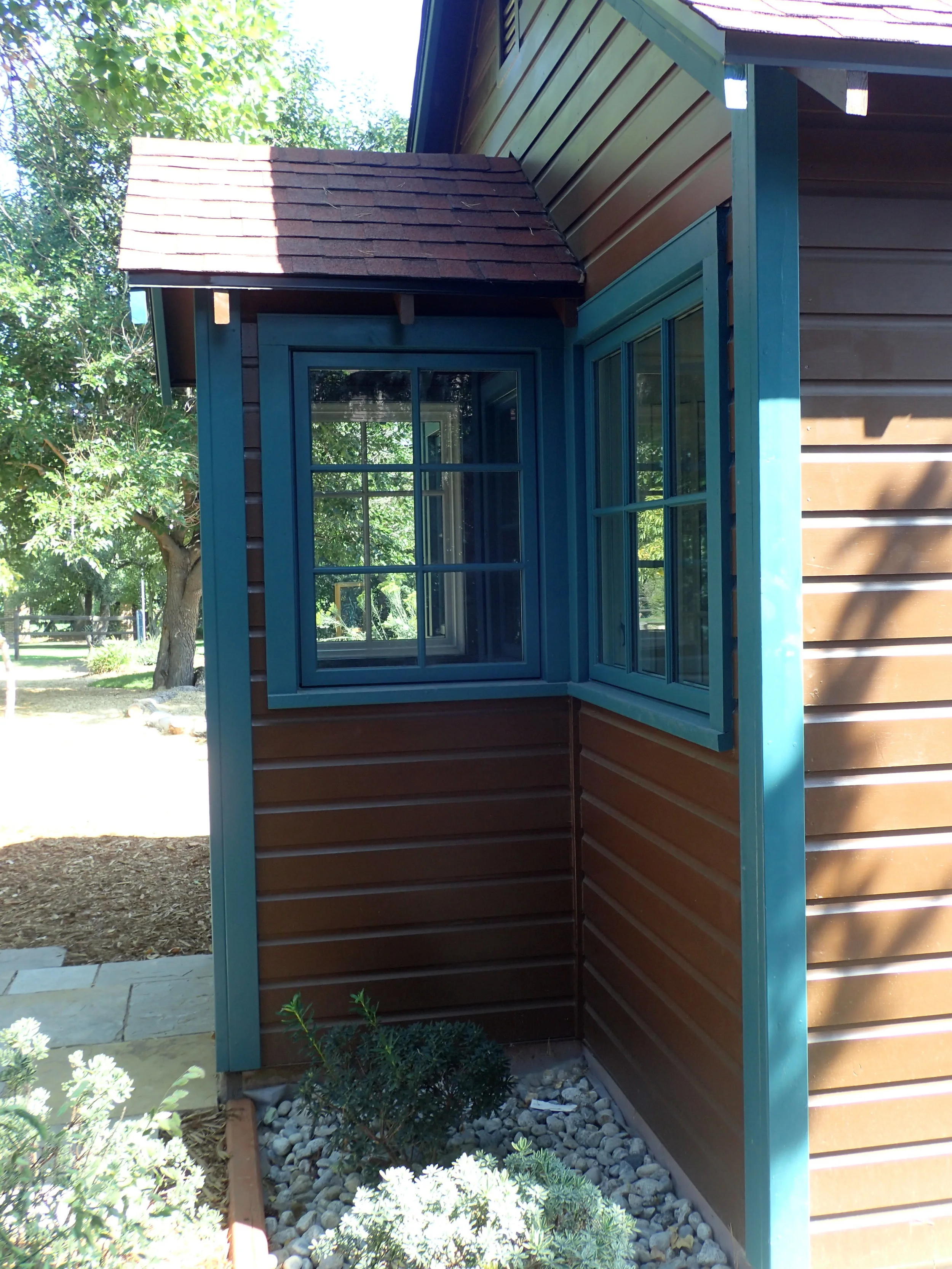 The view of the small covered porch entry to the building.