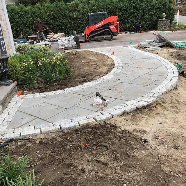 In progress!  New bluestone walkway with double cobblestone borders.  This is a full front and backyard transformation with some of the nicest clients -- more pictures to come soon!  #newenglandlandscaping #landscapedesign #hardscaping #justapeek