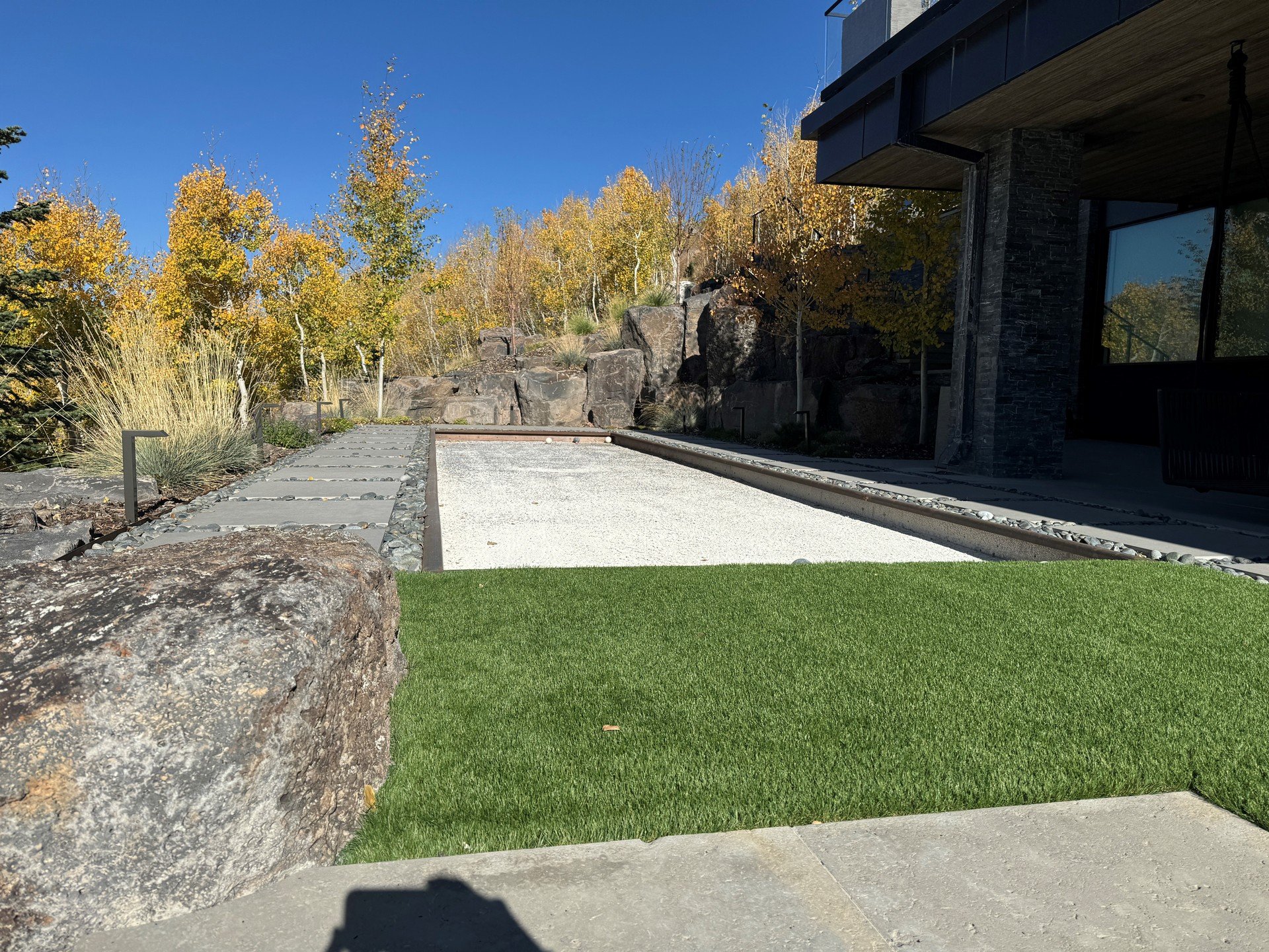 Everyone has heard of homes with theaters and personal bowling alleys, but we don't know of anyone else with their own bocce ball court! Our clients in Park City have an amazing view to enjoy the seasonal color changes whether they are playing a roun