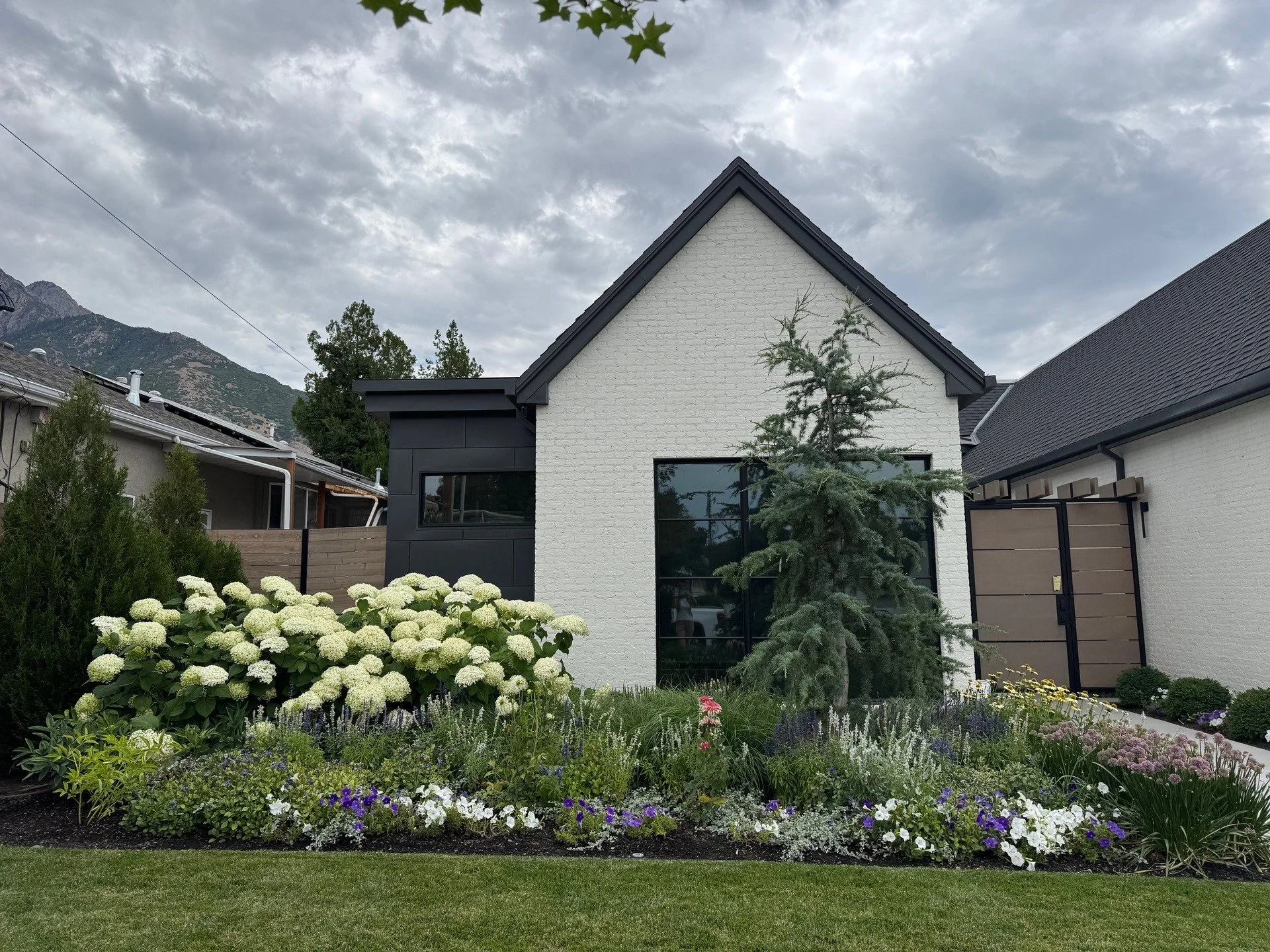 We're really pleased with how this landscape turned out. It demonstrates how a carefully crafted plan and execution can really boost your curb appeal!

#landscapedesign #landscape #utahlandscapers #utah #lawn #frontentry #cedruslibani #hydrangea #box