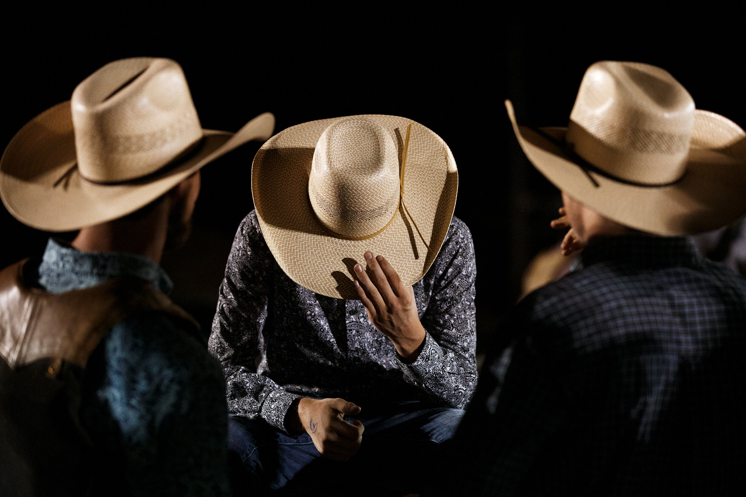  (Left to Right) Scott Rogers, Alex Woolums, and Jesse Wright gather together before the bull riding competition at the Fox Hollow Rodeo in Waynesville, Ohio, on Saturday, September 28th, 2019. There was tension in the air as this was the final compe