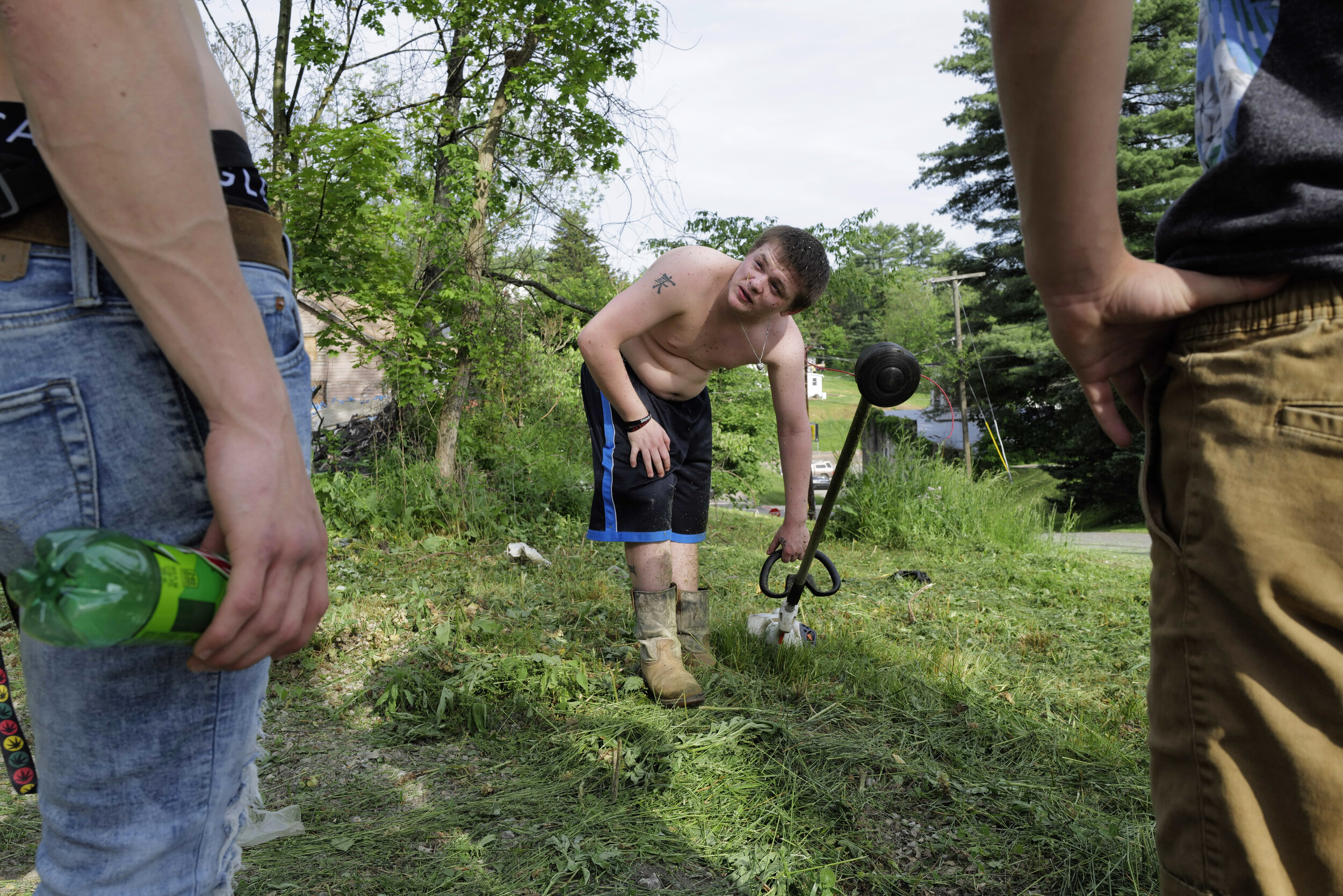  Reuben cuts the lawn on one of Ben’s properties in New Straitsville, Ohio, to earn his keep while friends come up to check on him on May 21, 2021. “I know if my dad was here now, he'd be disappointed, but I know he'd be proud of me at this point in 