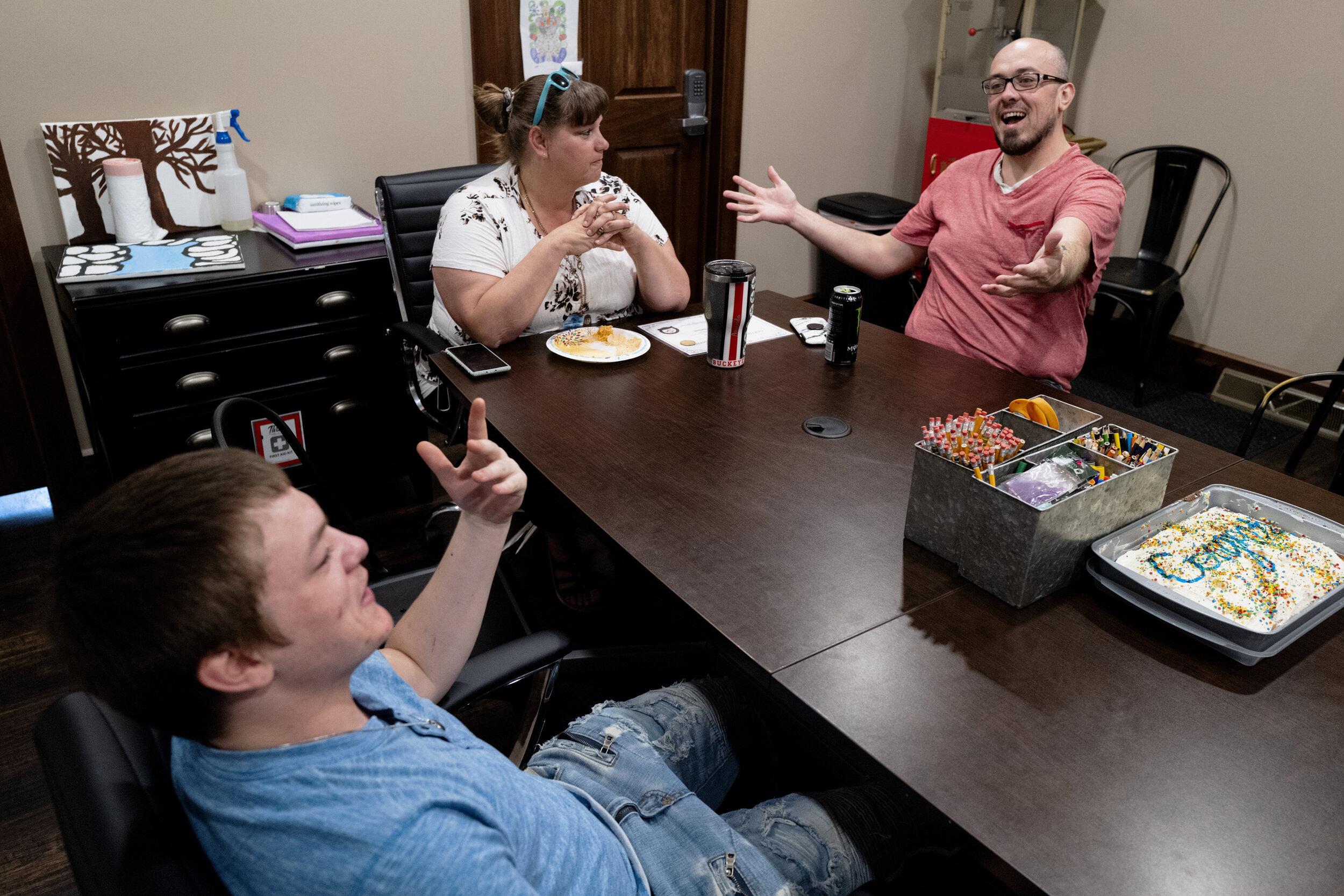  Reuben celebrates his graduation from IOP (intensive outpatient treatment), a rehabilitation that counsels him on his trauma and past drug usage, with Ben and his counselor Amanda Jennings in New Lexington, Ohio, on May 25, 2021. “I’m so proud of hi