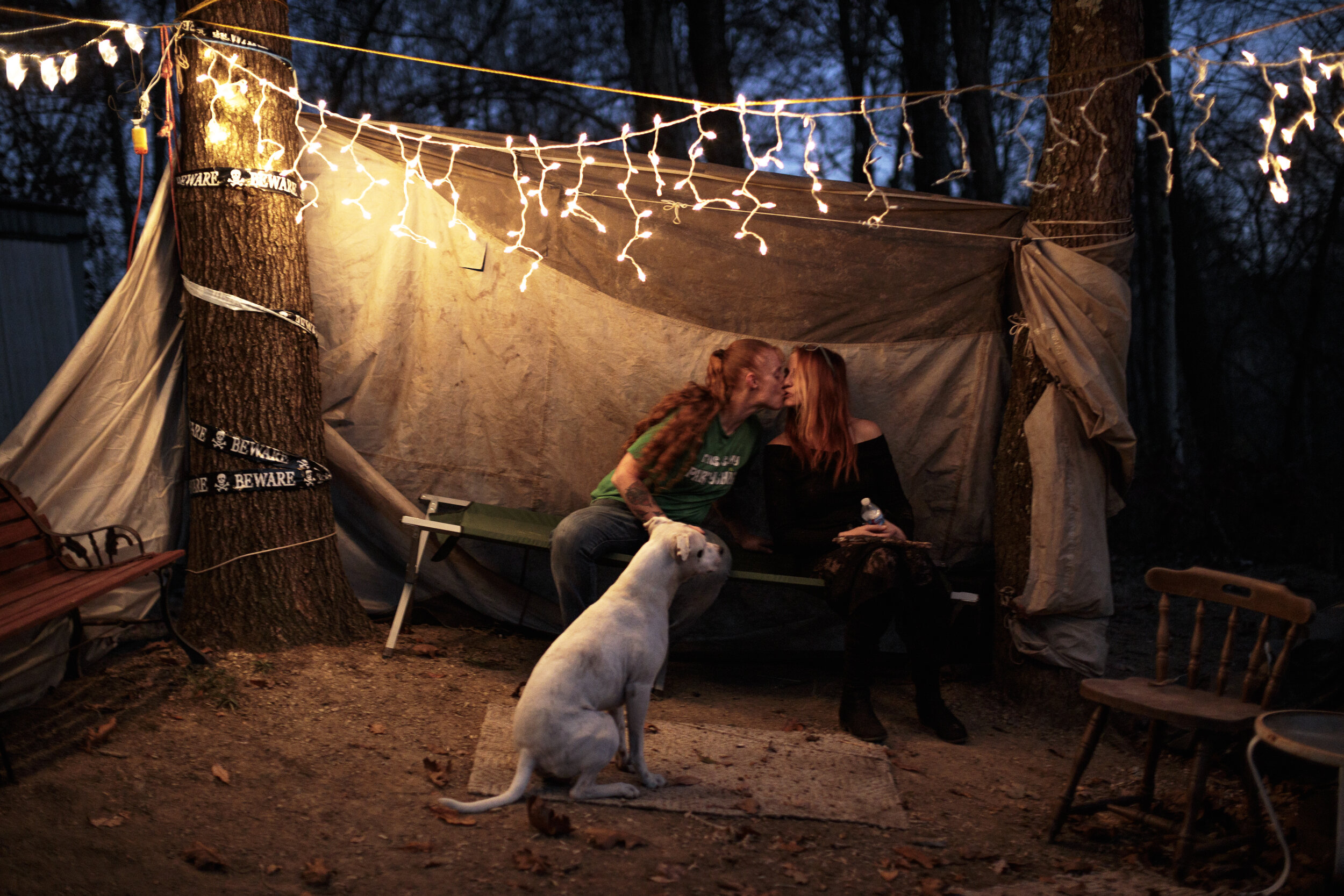  Leslie and Staci kiss in a makeshift lounge outside their trailer. “I just feel her. I feel her when she touches me. When she kisses me, I just feel something,” says Leslie. The reason [for marriage] for me is to make our family whole and complete,”