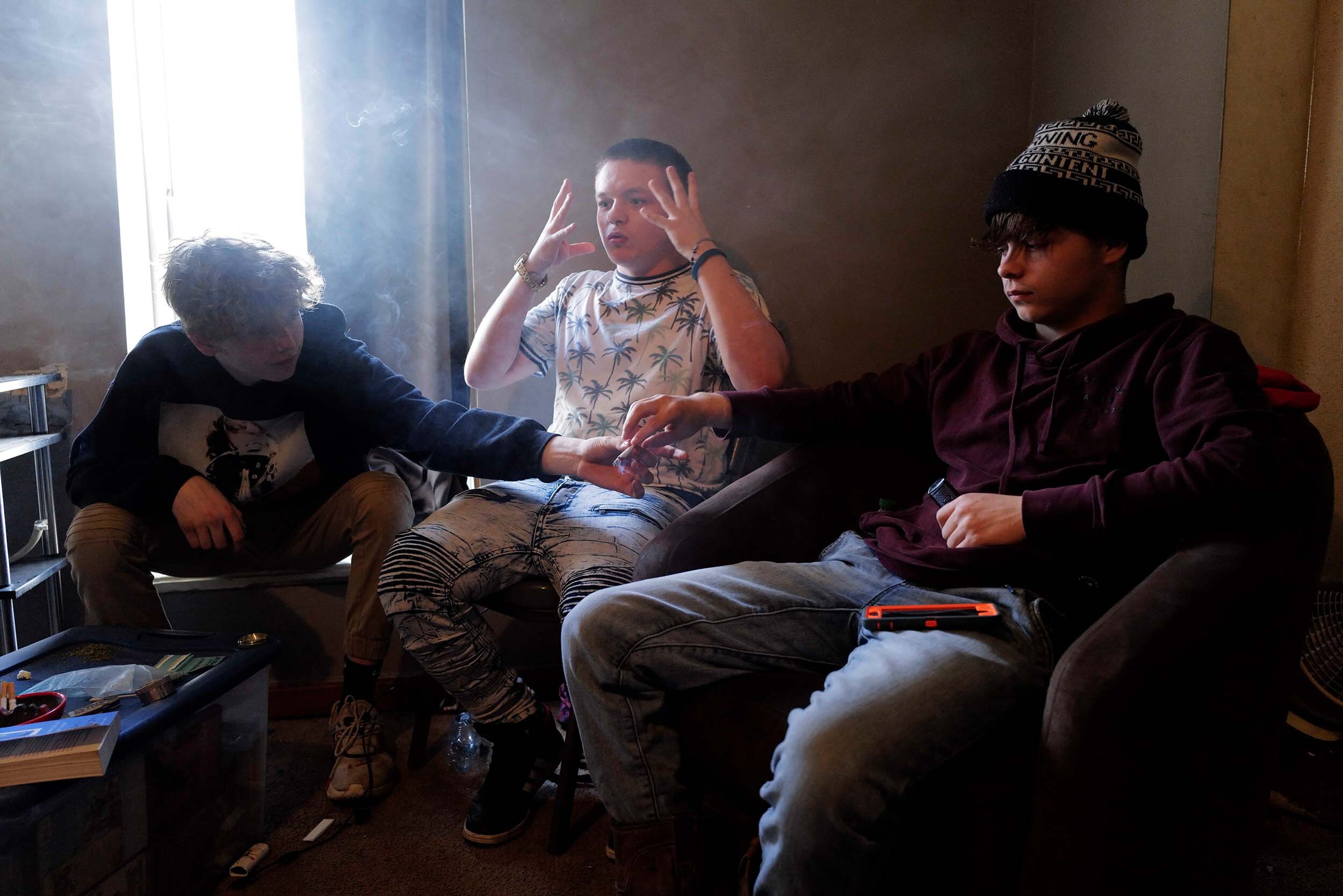  Reuben smokes a joint with his close friends (left) Damon McGee and (right) Ethan Rudder at Ben’s home in New Straitsville, Ohio, on March 26, 2021. “I think about what I had before compared to what I have right now and it's like, I had so much more