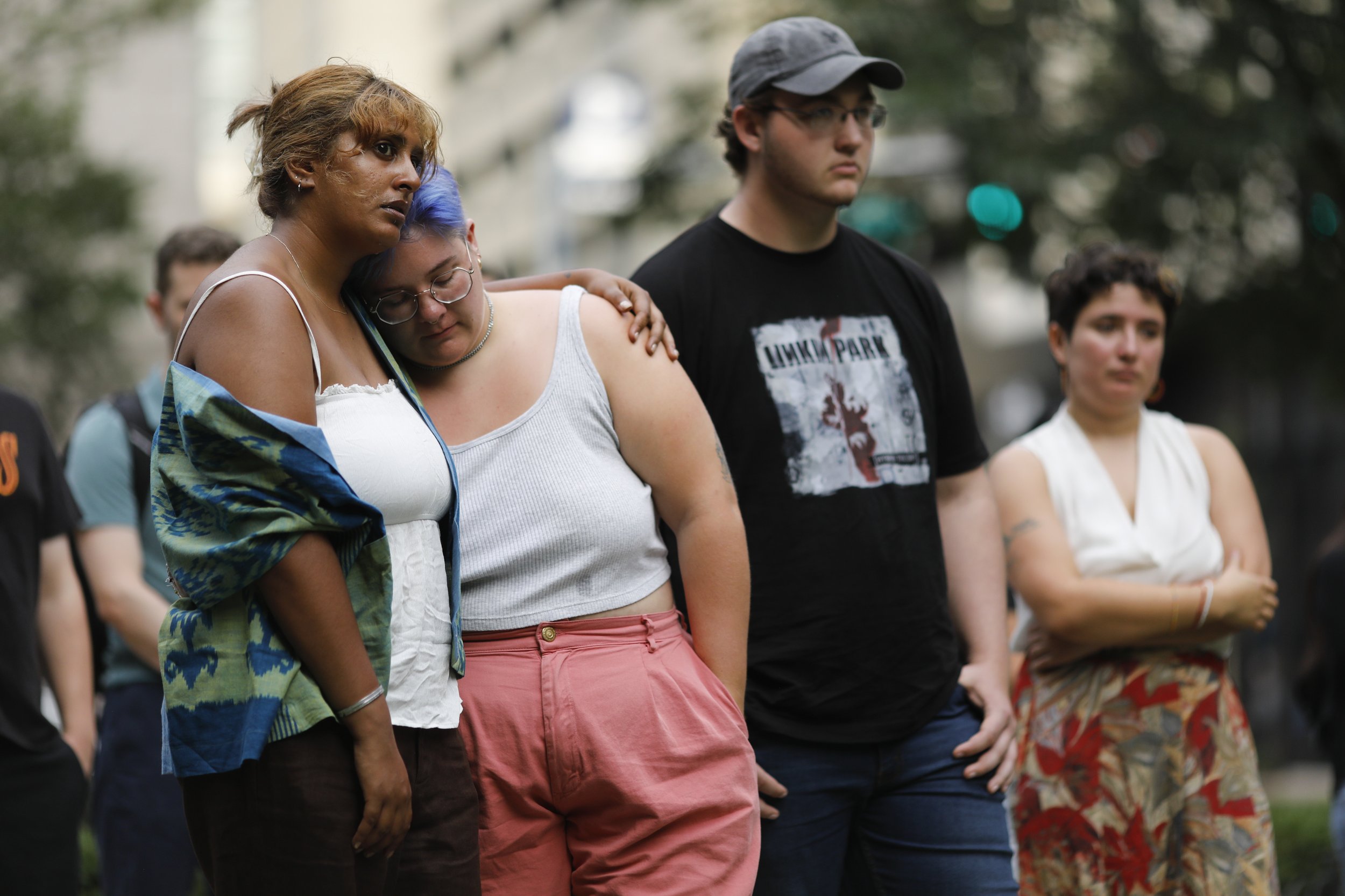  Bhargavi Garimella (left) embraces Allanah Rolph during a gathering to remember the life of Rodrigo Ventocilla and demand action from the Peruvian government at Statler Park in Boston on September 4, 2022. Ventocilla, a trans activist and Peruvian n