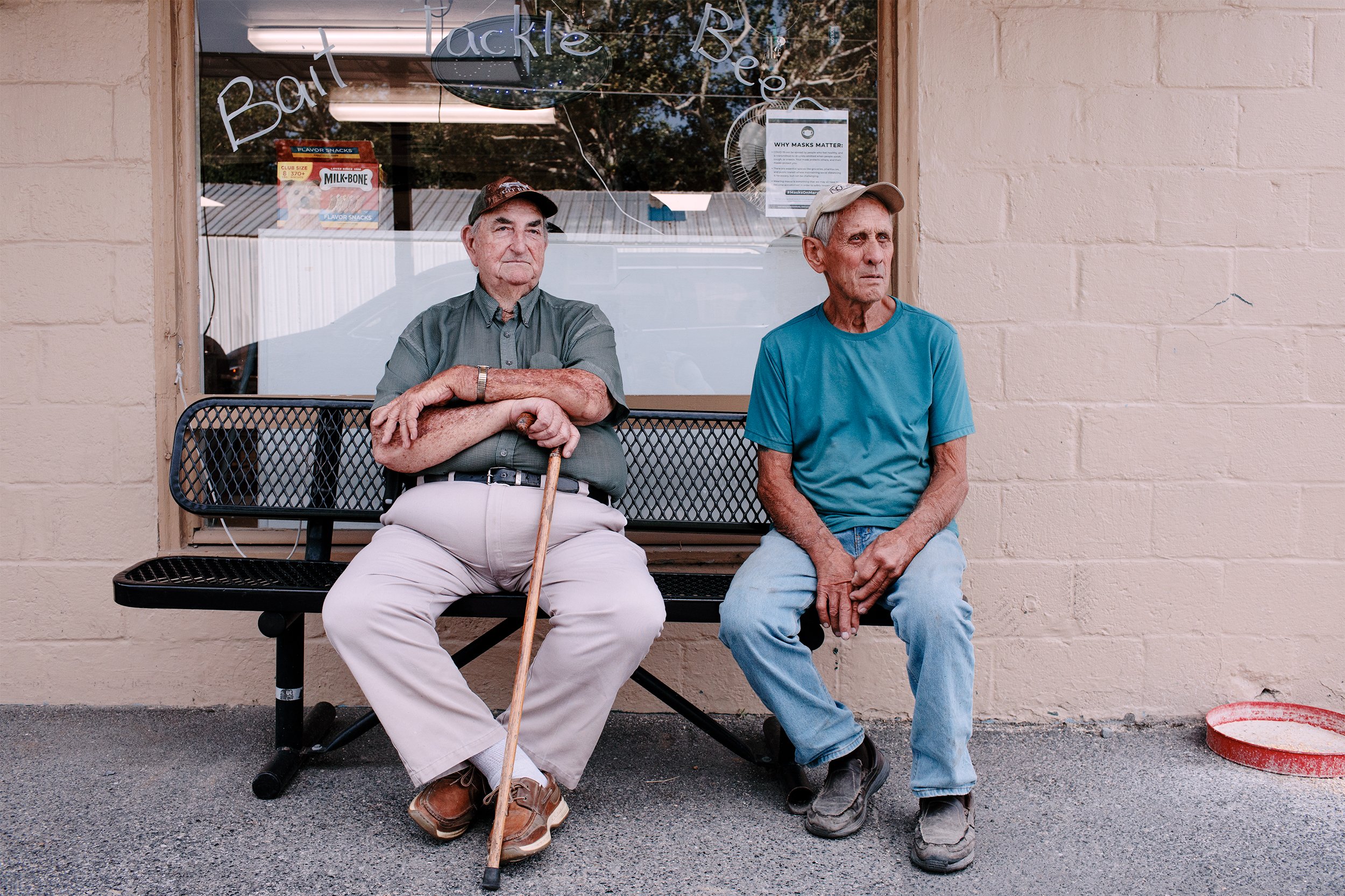  From left, Stanley Larrimore, 90, and John Kinnamon, 83, sit outside of Fairbank Tackle in Tilghman Island, where the local waterman community would pass time before and after fishing. Larrimore said it “used to be so full of people.” Larrimore star