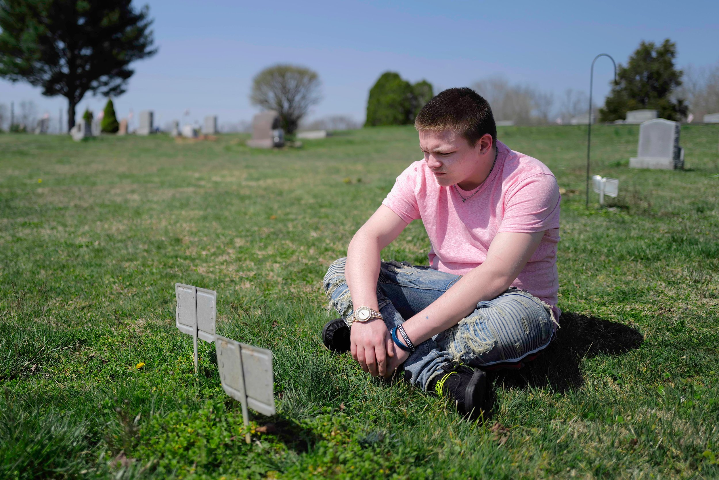  Reuben visits his father James and his uncle Kevin's grave at Hilltop Cemetery in Millfield, Ohio on April 4, 2021. “The first traumatic experience I experienced in life was the loss of my father. He drowned in his car… He’s a drug dealer and stuff 